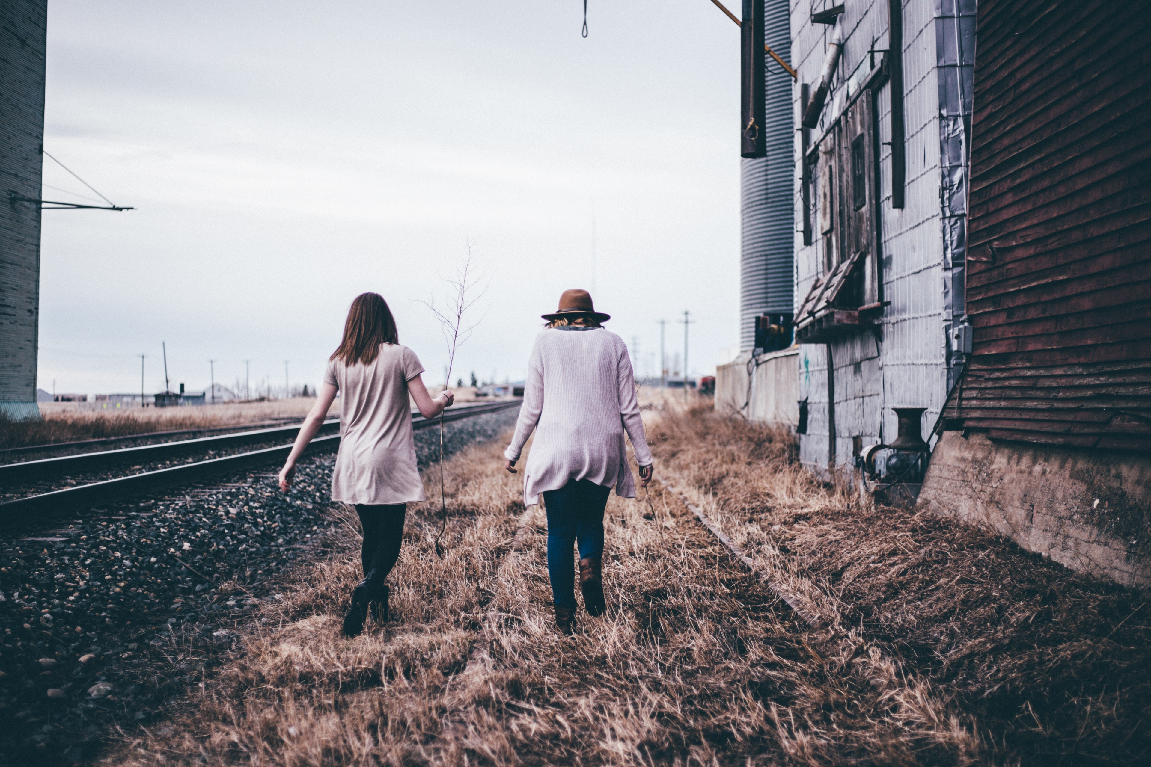 two friends walk by abandoned railroad tracks in fall, spooky adventures 4k, HD Wallpaper