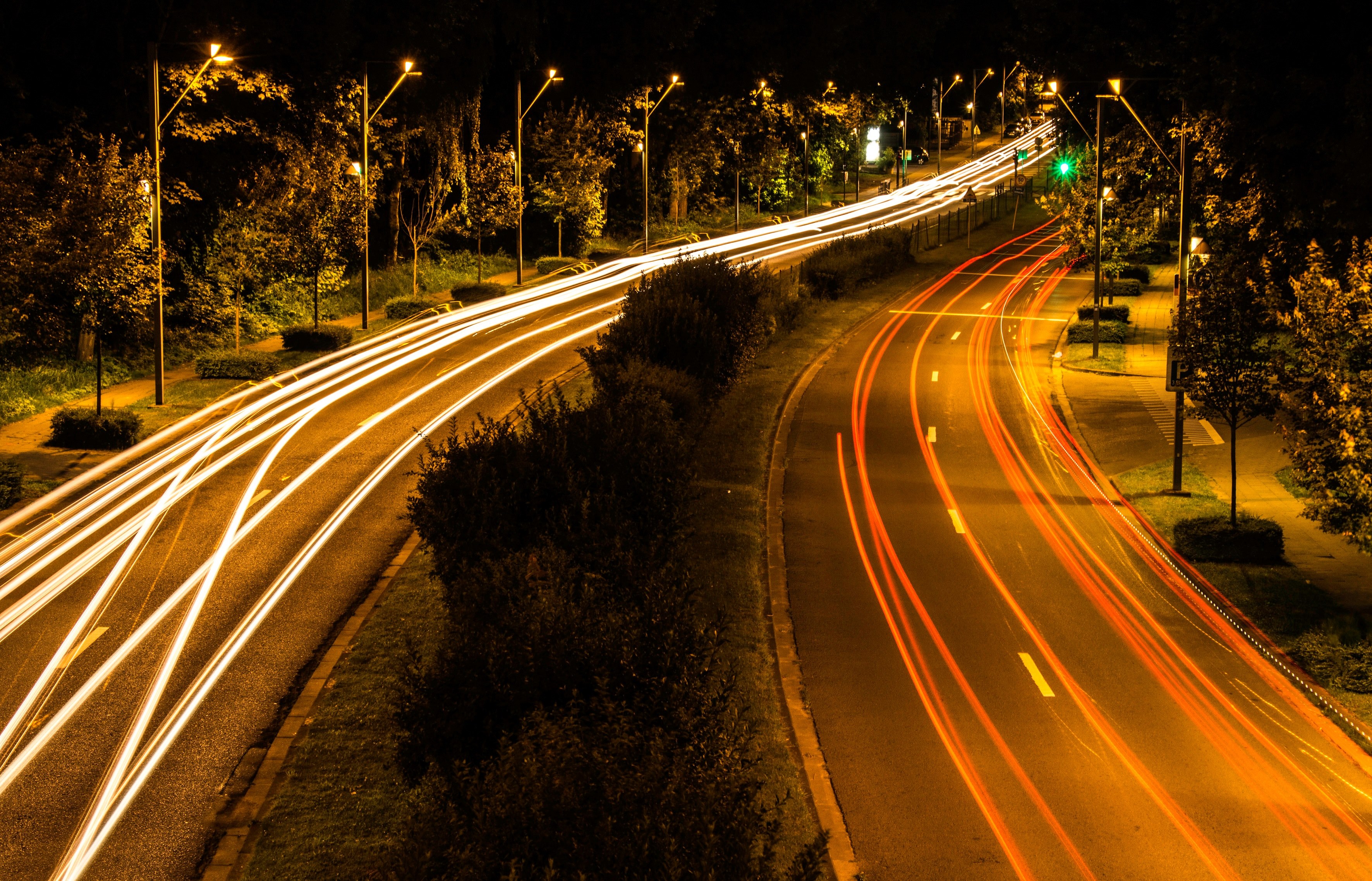a slow shutter photo showing headlight trails along a dual highway in jette, jette highway traffic at night 4k, HD Wallpaper