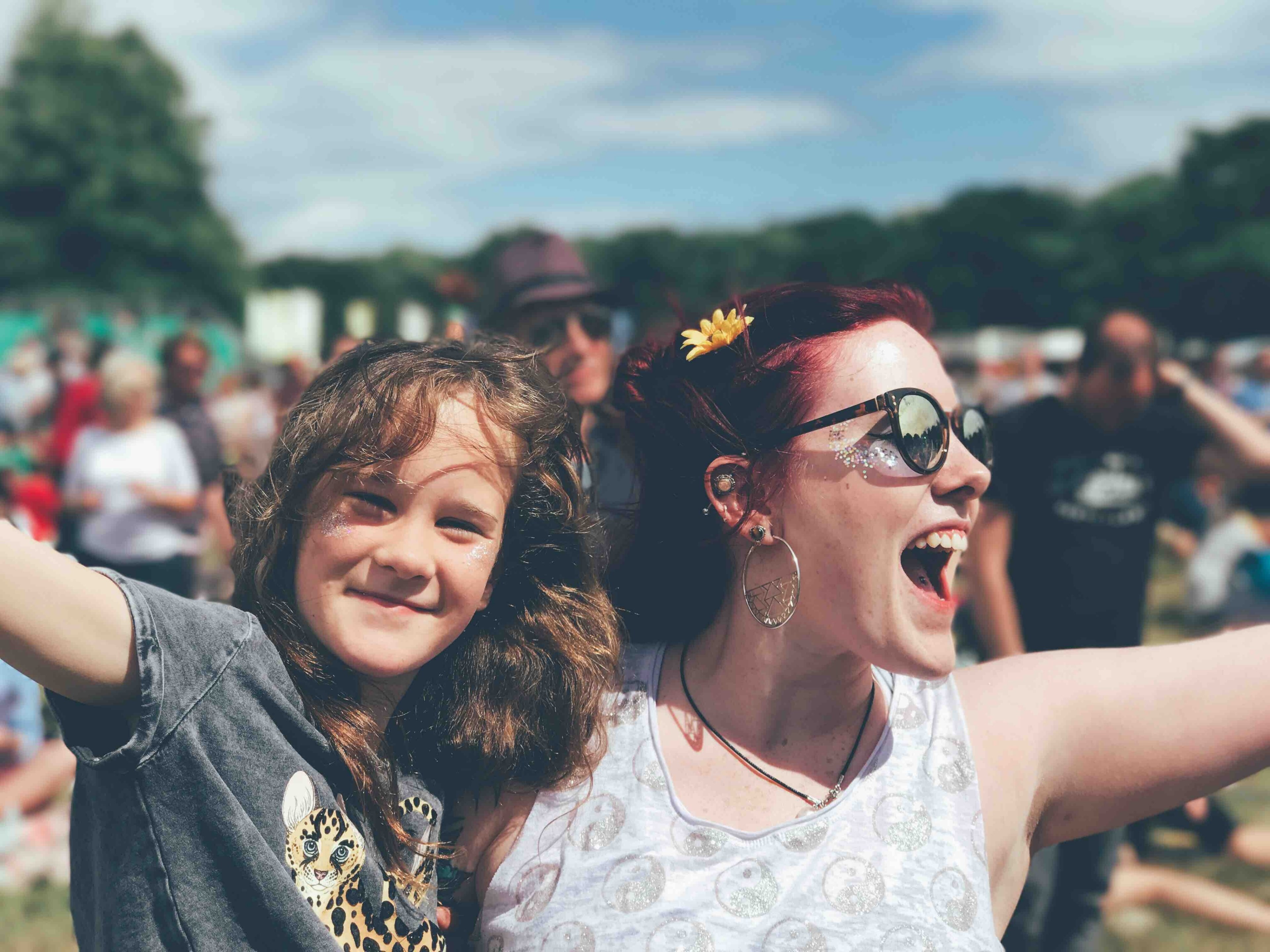 a woman and a girl cheering at a festival, festival fun 4k, HD Wallpaper