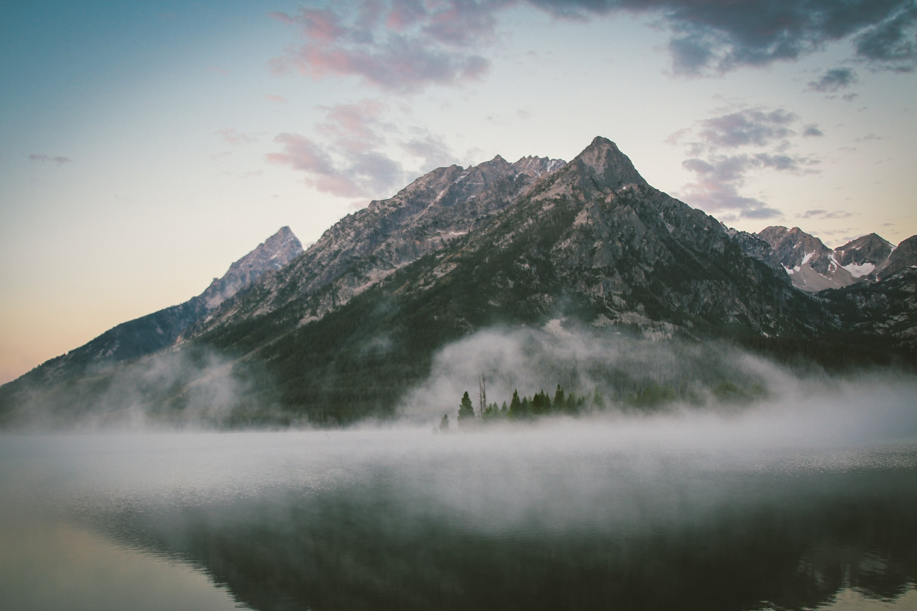 a majestic mountain peak with a mist at its foot towering over the calm surface of a lake, majestic mountain by the lake 4k, HD Wallpaper