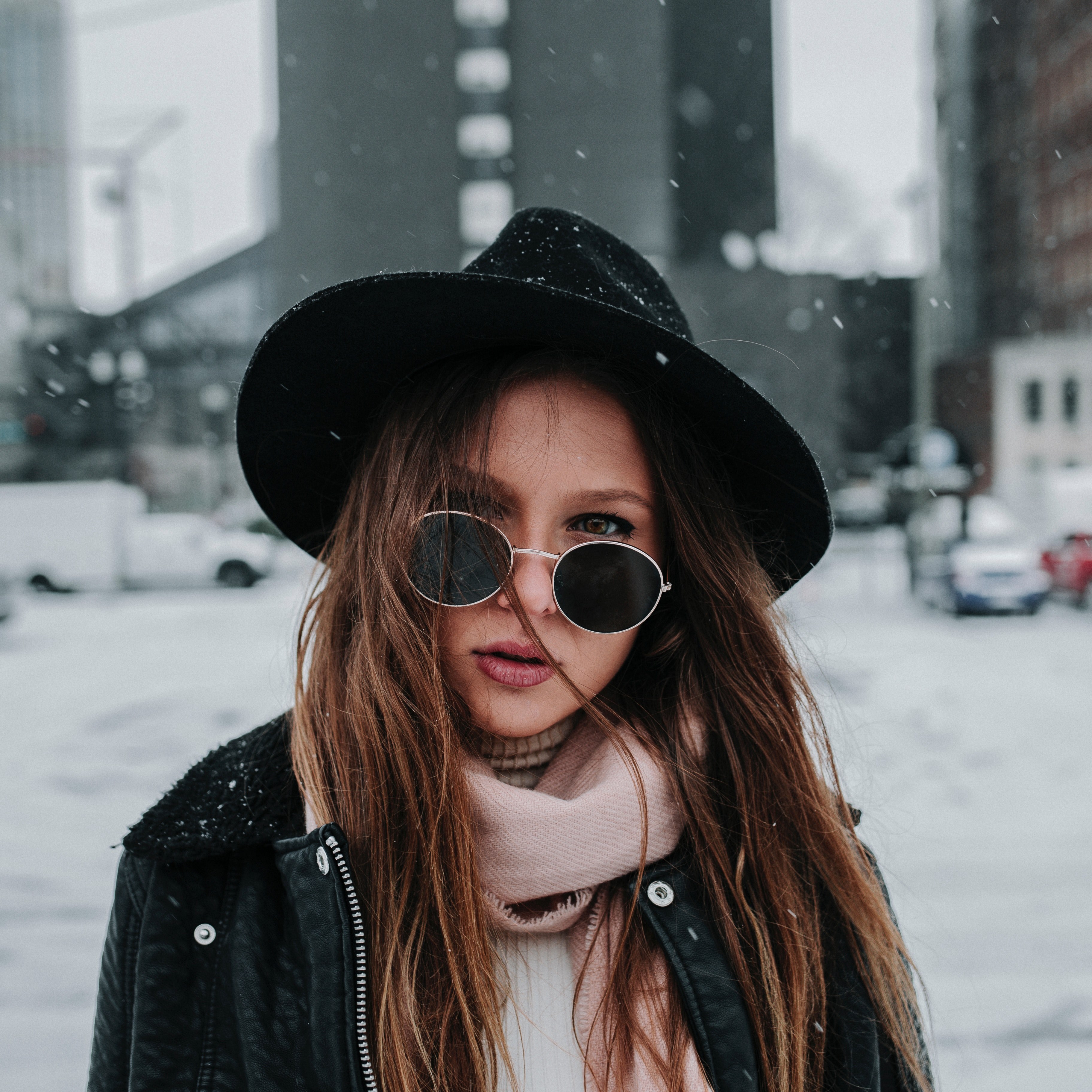 a brunette woman wearing a hat and sunglasses standing in the snow in nashville, fashionable snow gear 4k, HD Wallpaper