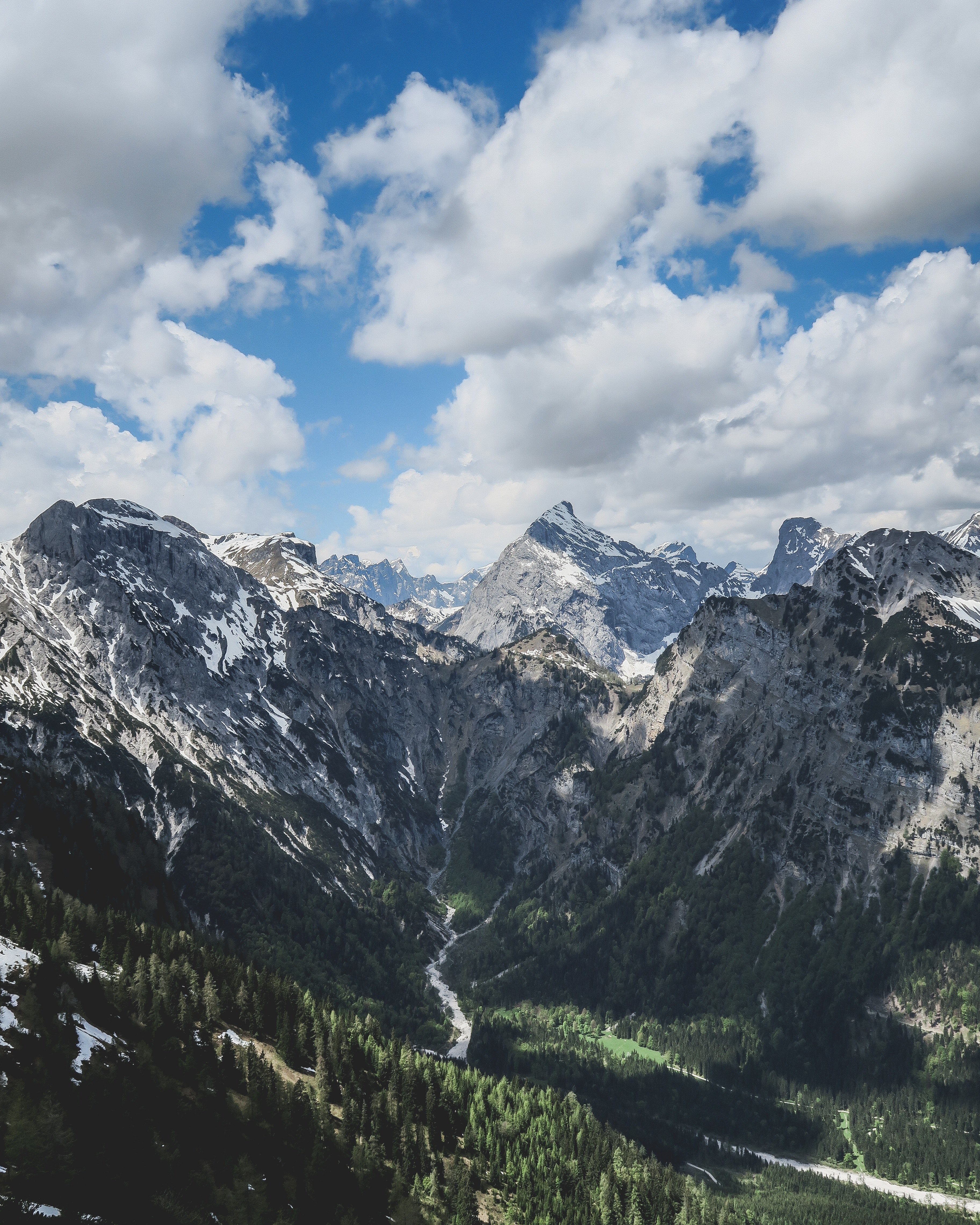 river flowing from the snowy peaks of pertisau into the pine valley on a cloudy day, river valley pertisau 4k, Phone HD Wallpaper