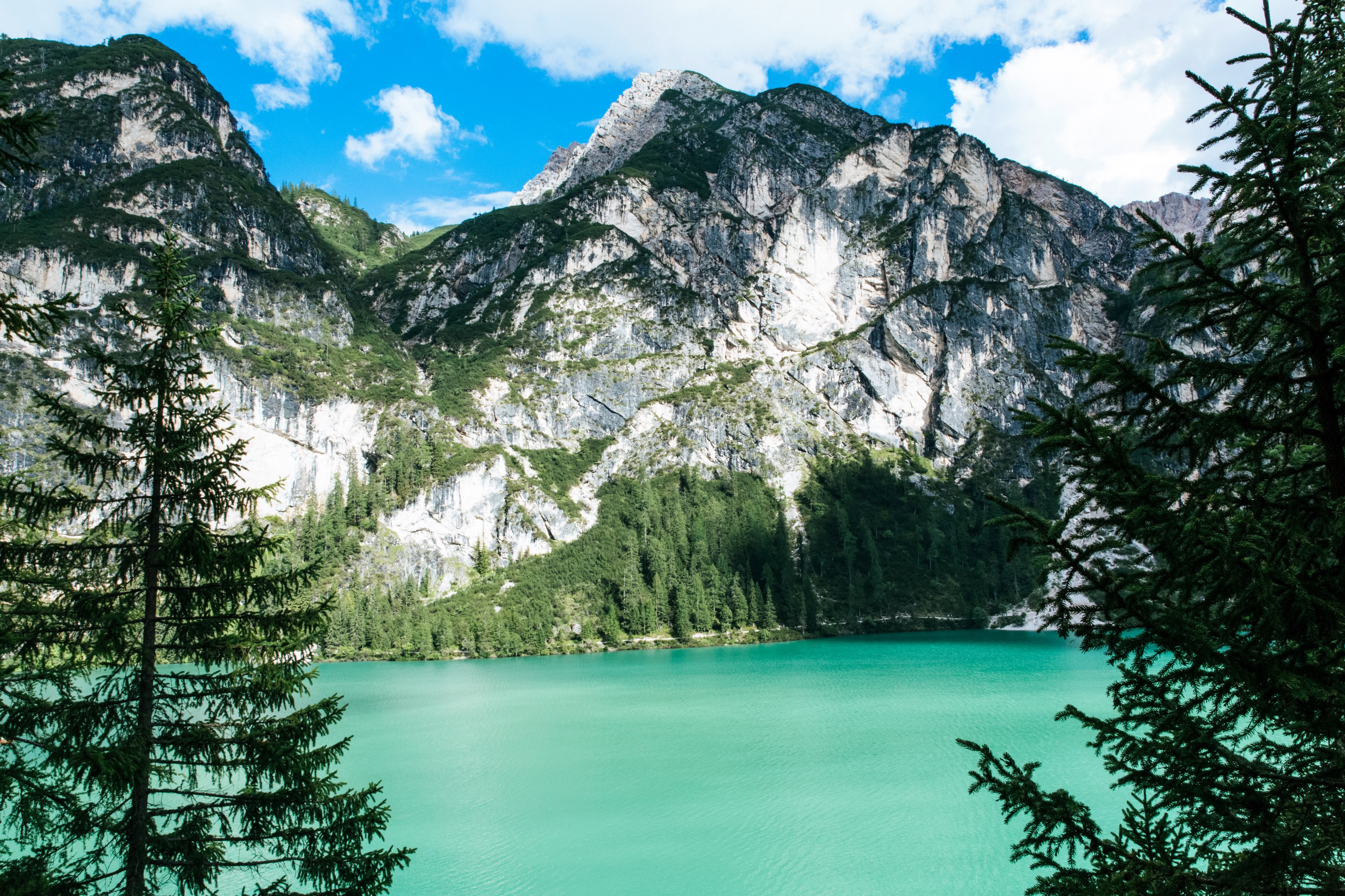 a picturesque landscape with a turquoise lake at the foot of a rugged mountain, turquoise mountain lake 4k, HD Wallpaper