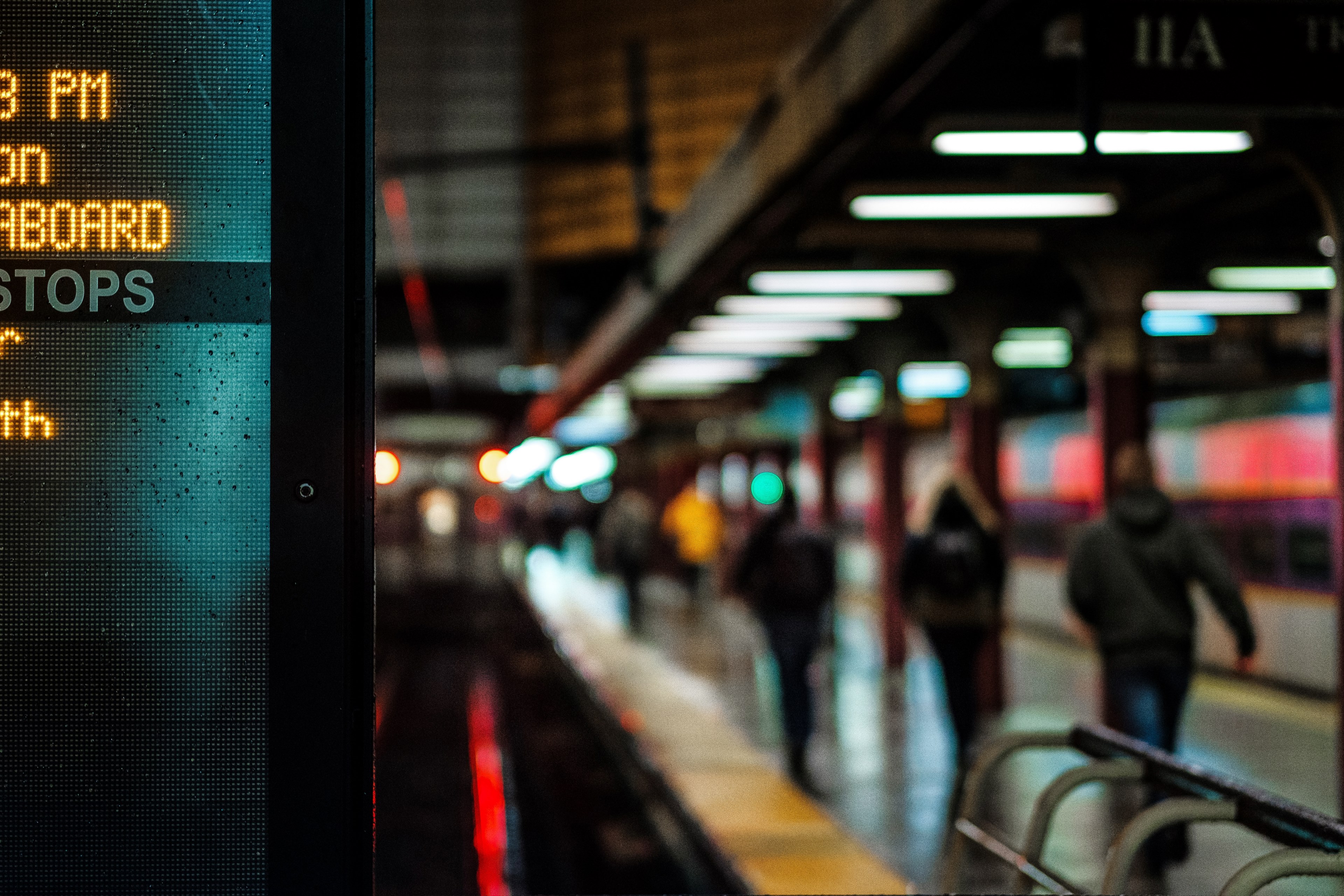 city subway platform lit with signs and commuters walking to their destination, urban public transportation 4k, HD Wallpaper