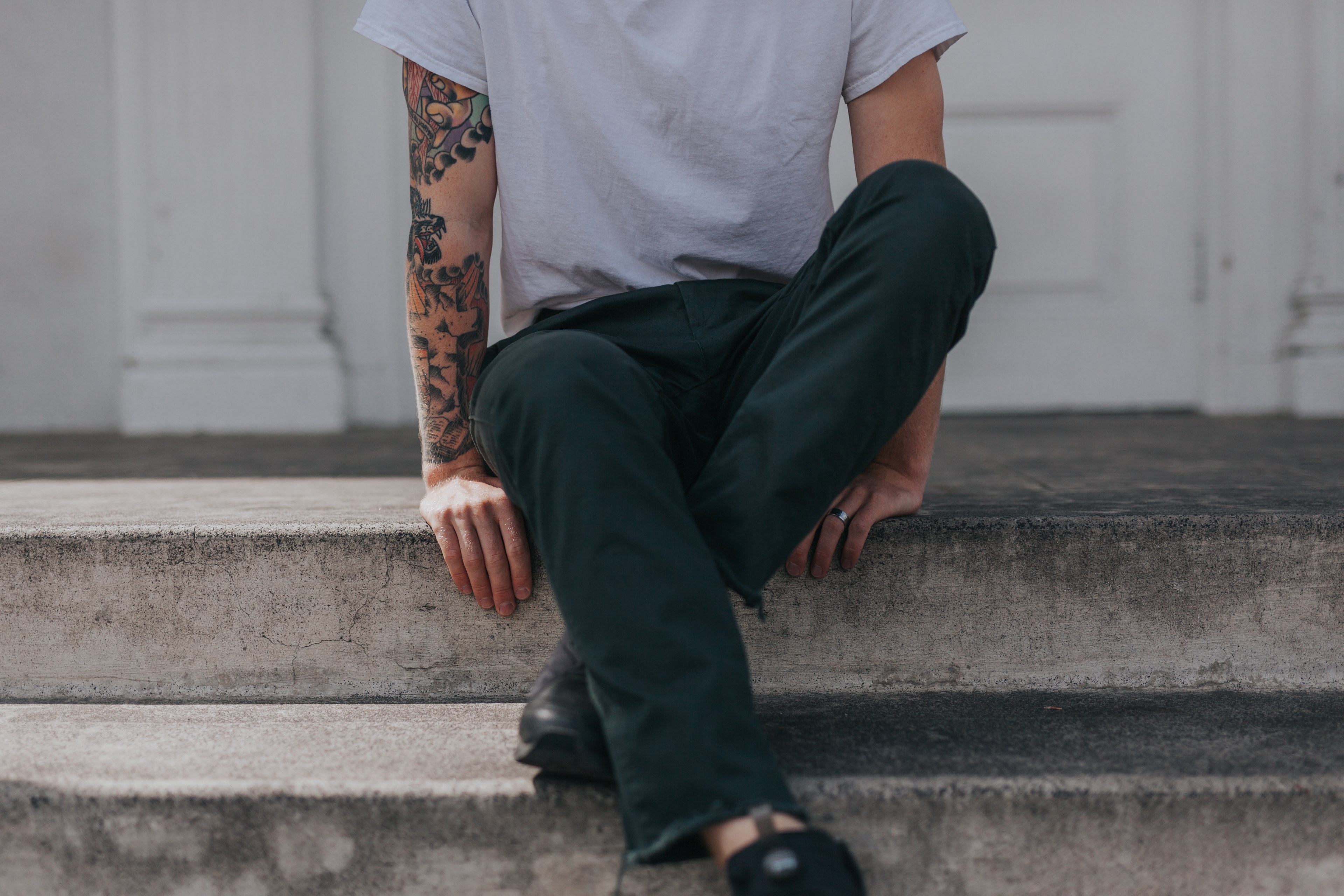 low shot of a person with an art tattoo sitting on a porch step, sitting on a porch 4k, HD Wallpaper