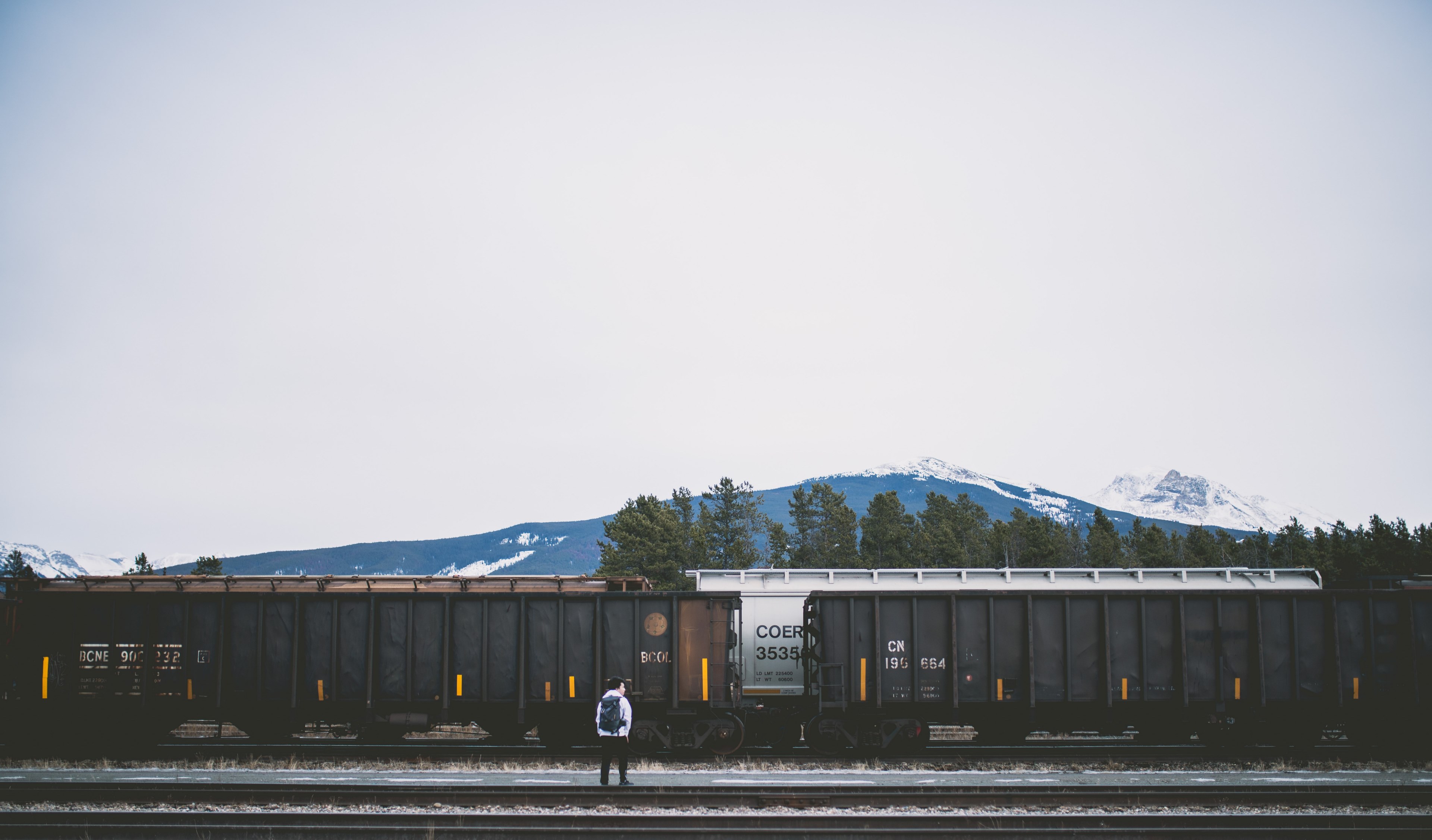 person alone with backpack standing near cargo train and railroad in jasper, cargo train and person in jasper 4k, HD Wallpaper