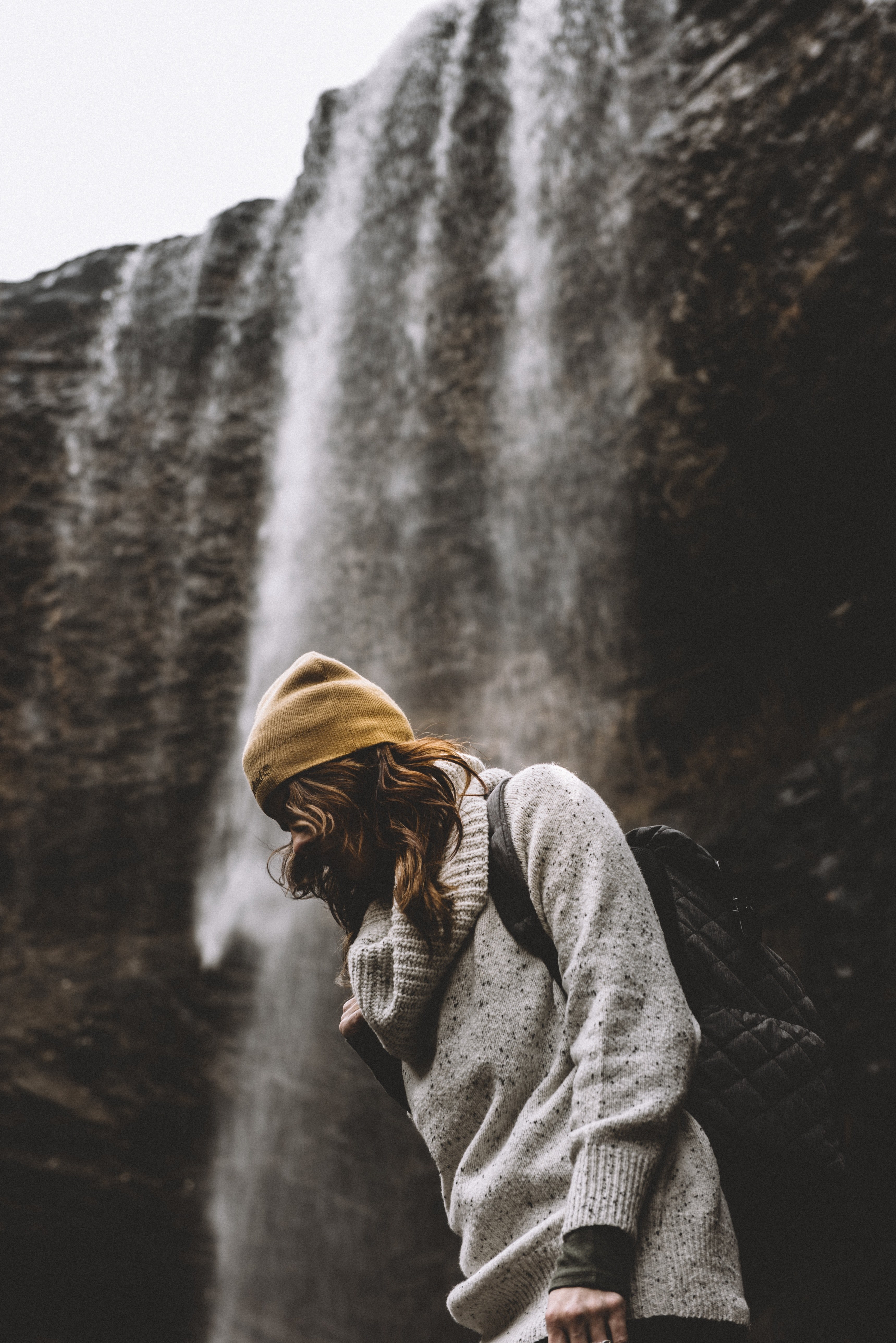 hiker wearing a backpack walking past a waterfall, waterfall hike 4k, Phone HD Wallpaper