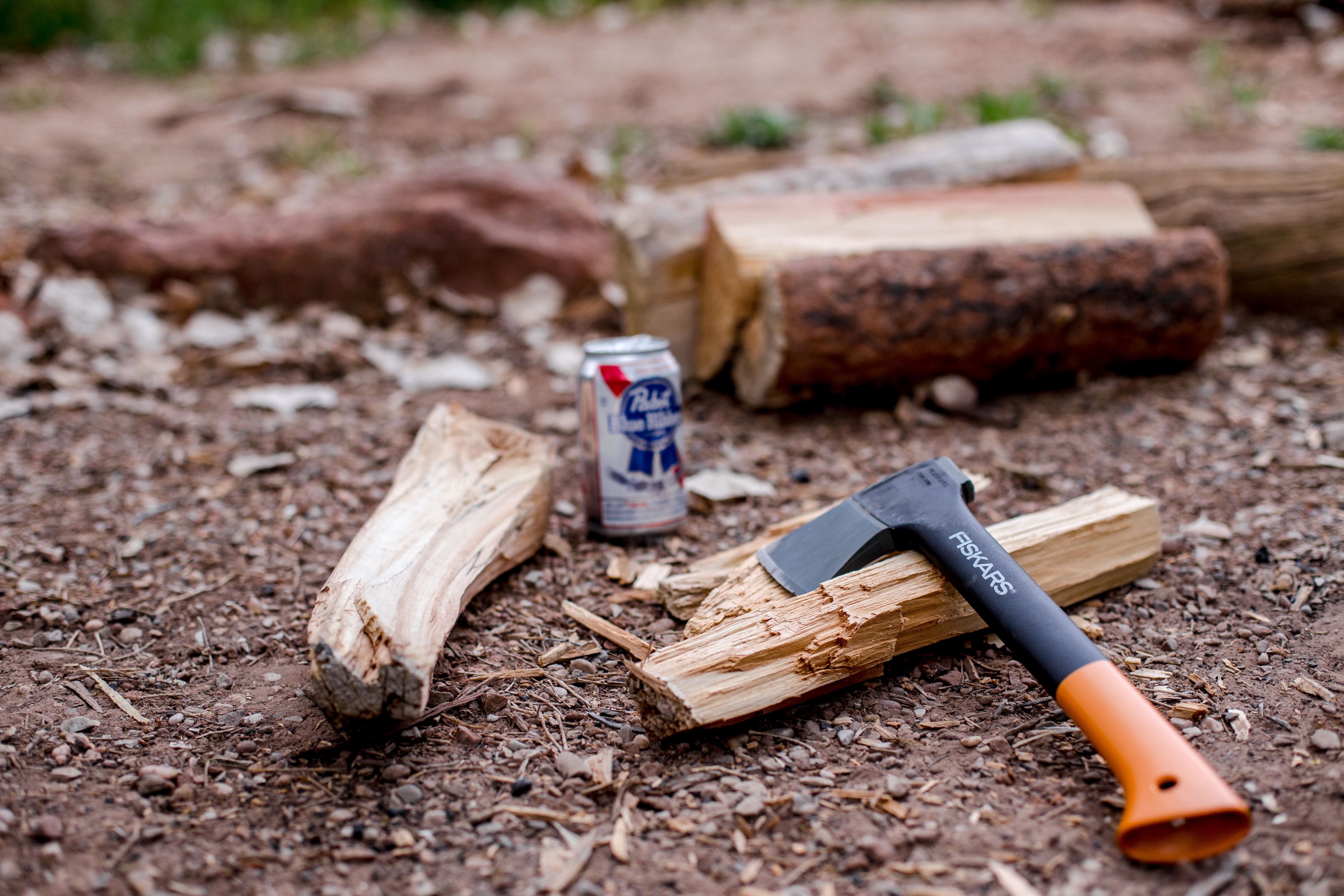 a small axe placed next to chopped wood and a beer can on the ground in watchman campground site b 9, lumberjacks break 4k, HD Wallpaper