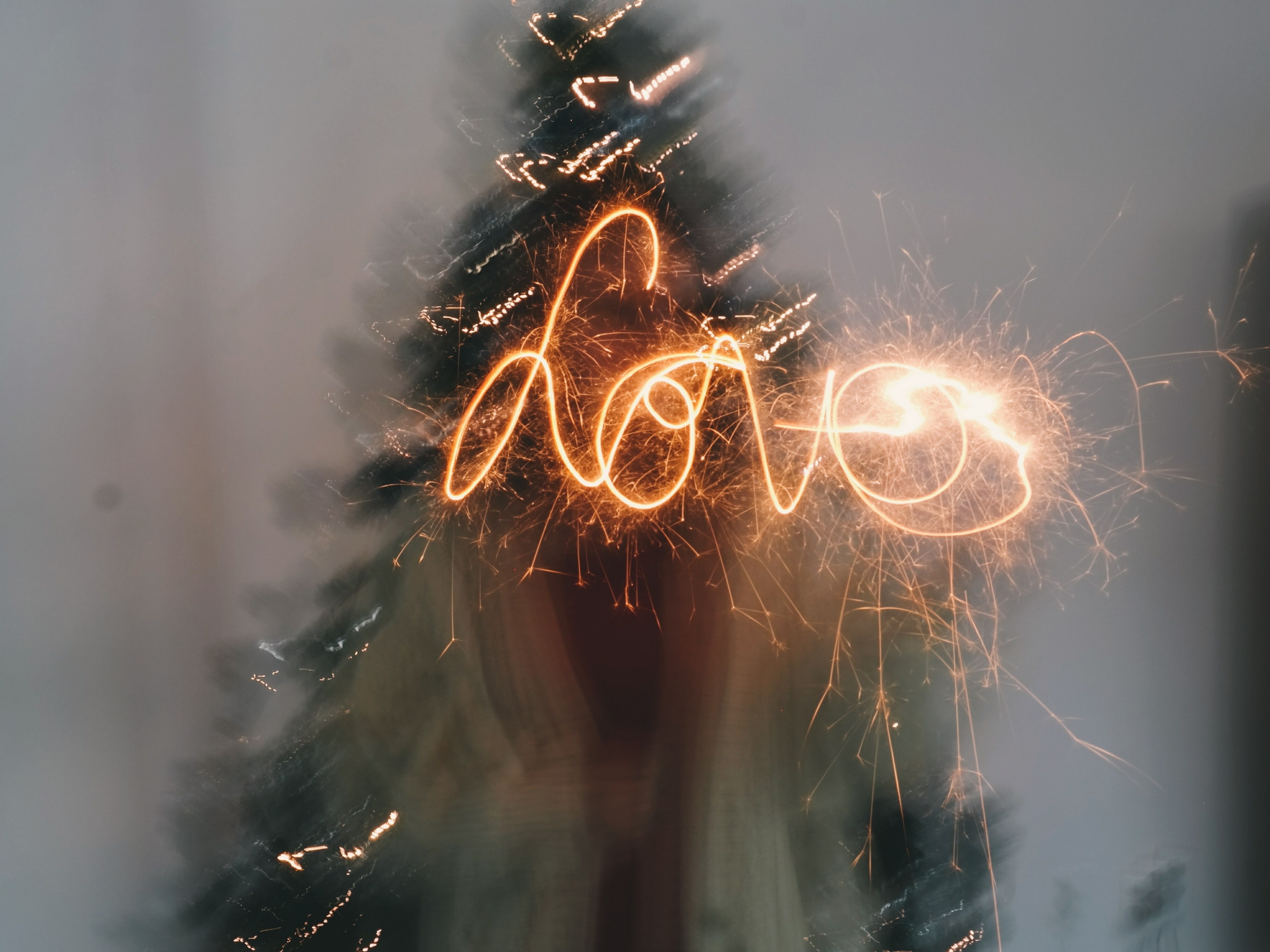 person with a sparkler spells out the word love, love in sparkles 4k, HD Wallpaper