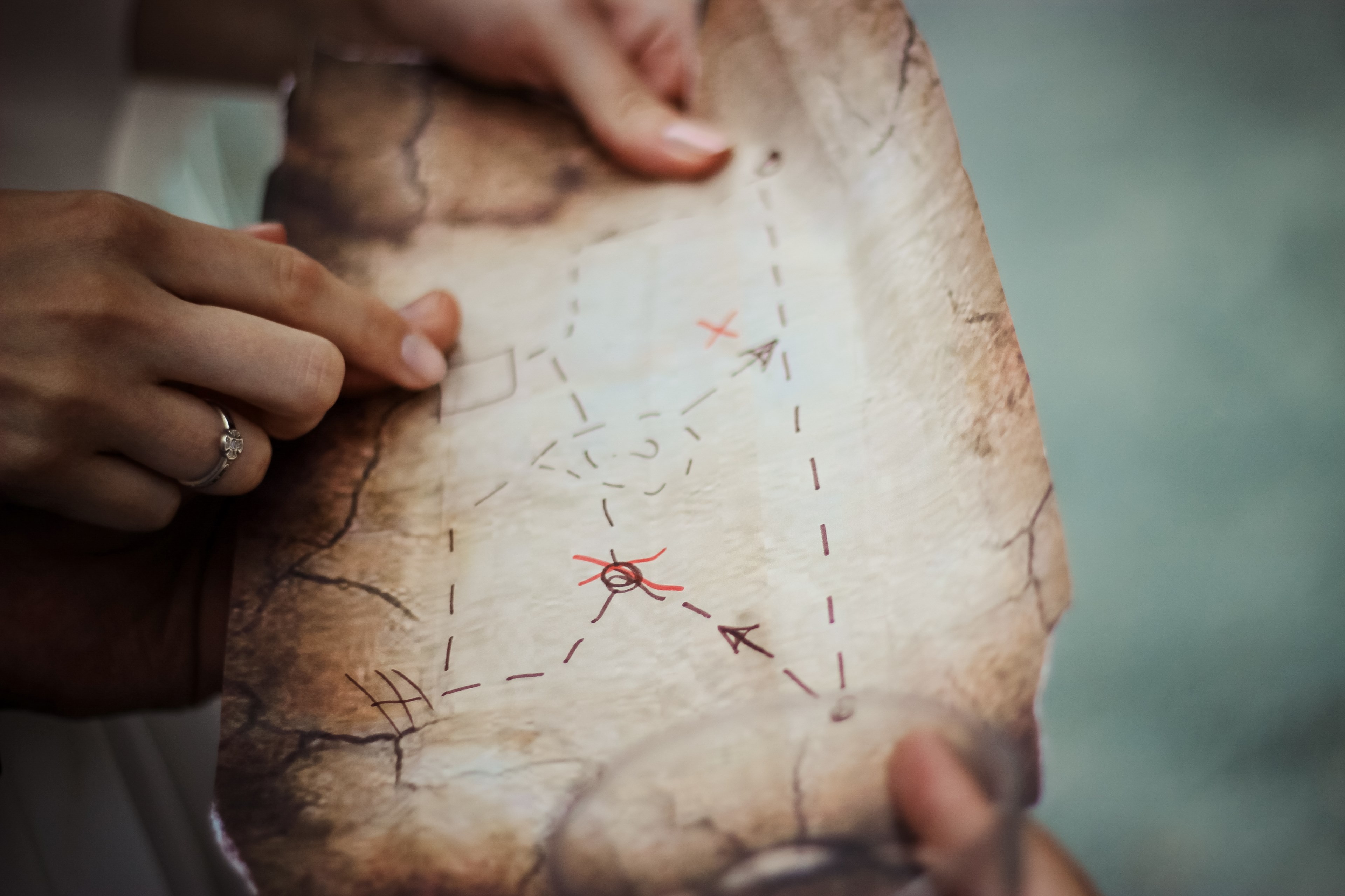 two people holding up an old map with directions and x marks drawn with a marker, treasure hunt map 4k, HD Wallpaper