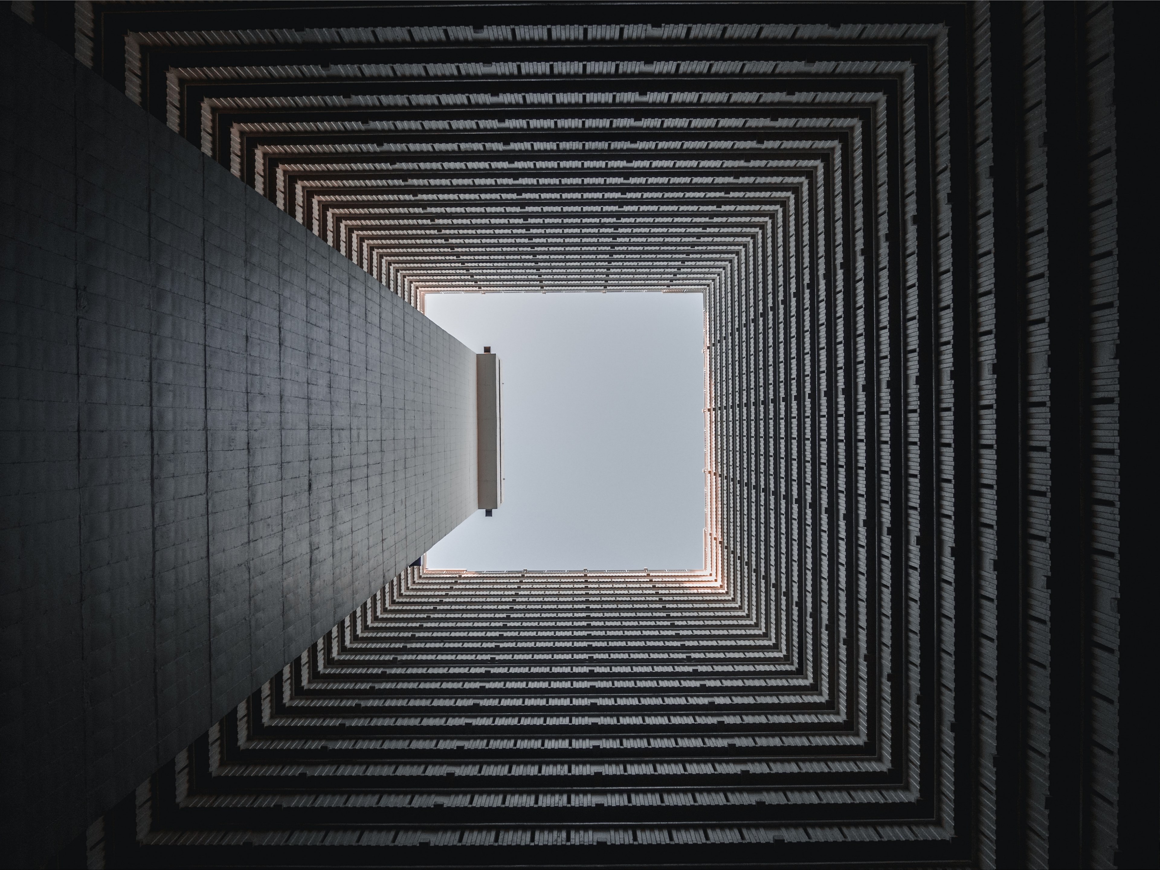 view from the bottom of a square well on the blue sky above, lines 4k, HD Wallpaper