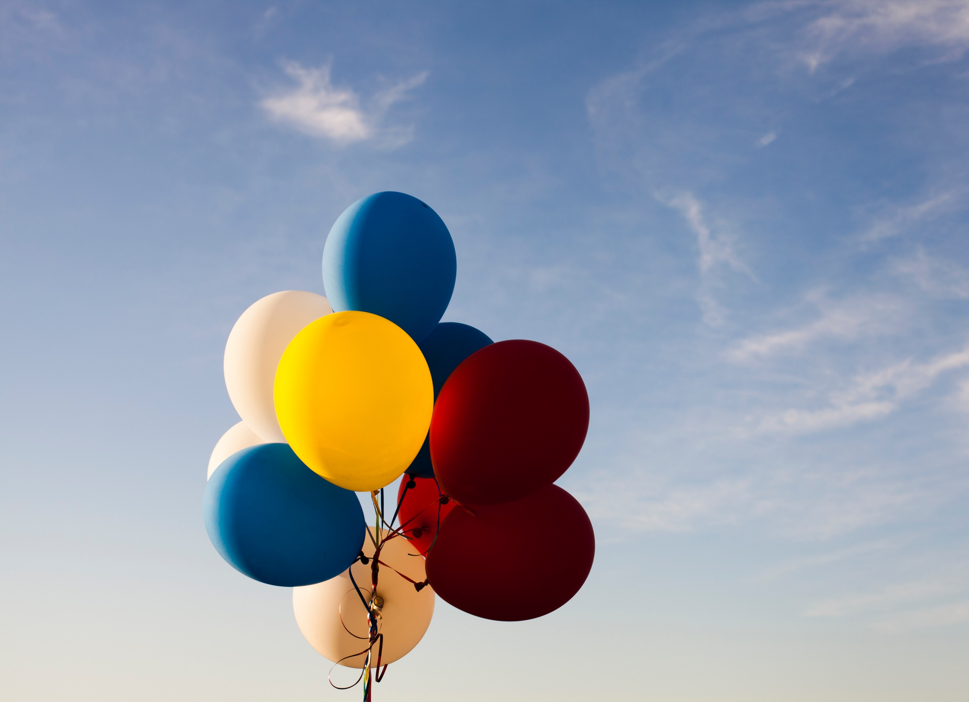 colorful balloons on a string against a blue sky, balloons on a string 4k, HD Wallpaper
