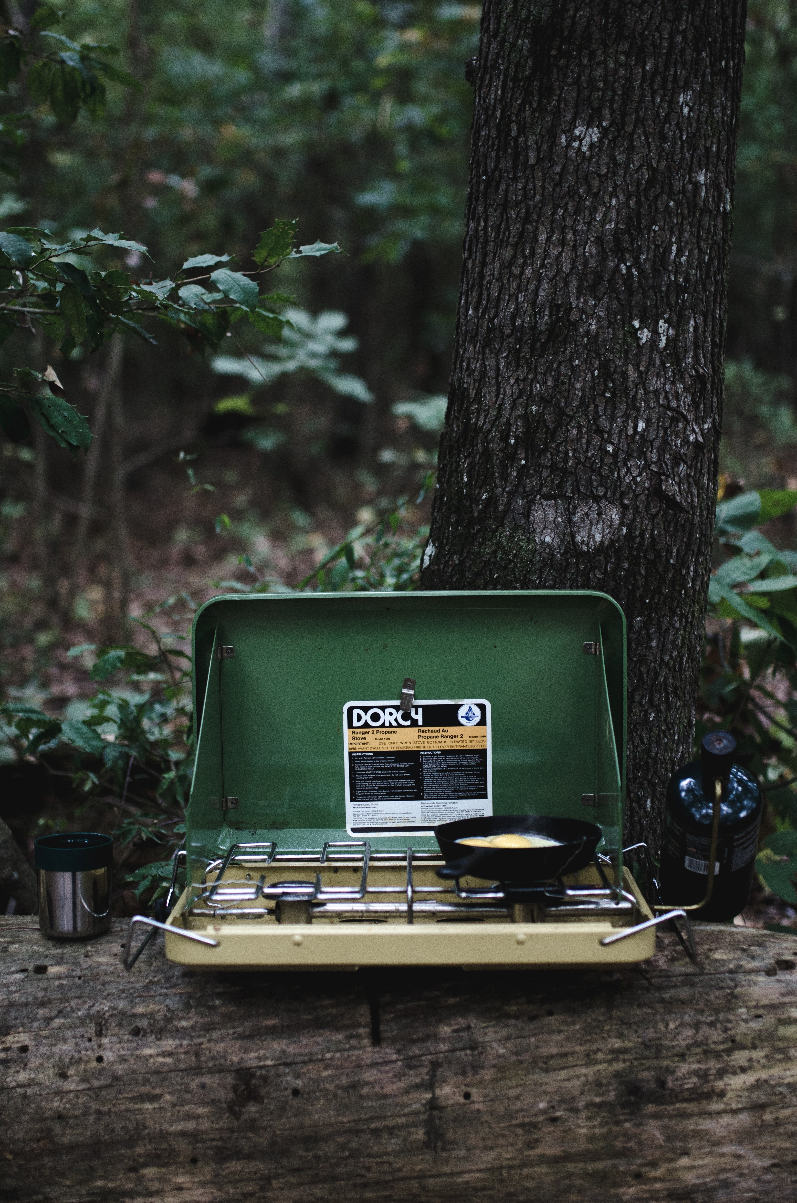 yellow and green vintage camping grill with a pan making fried eggs, breakfast is served 4k, Phone HD Wallpaper