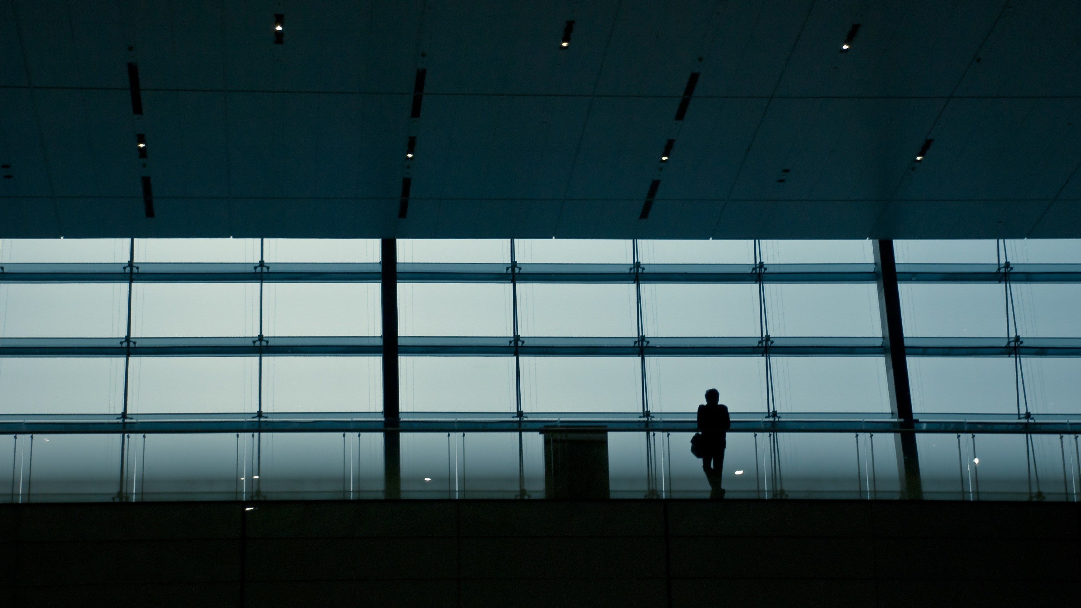 a silhouette of a person in a dark railway terminal, railway terminal silhouette 4k, HD Wallpaper