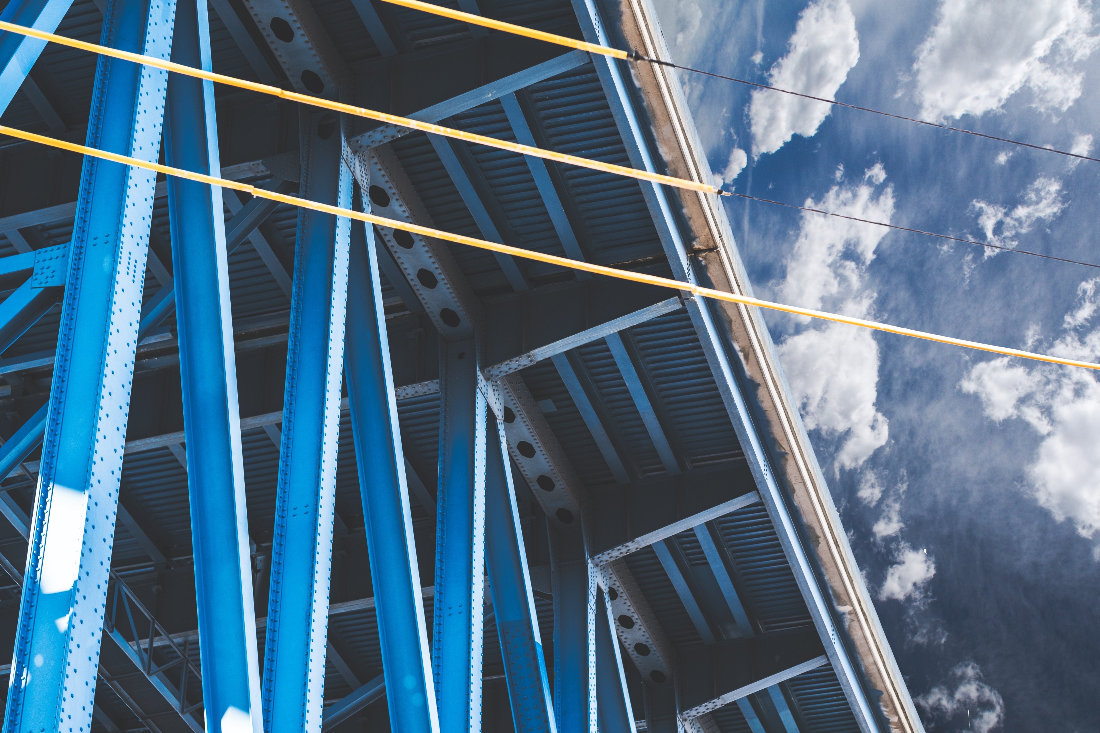 a blue structure with yellow cables in cleveland with sky and clouds in the background, bright industrial building in cleveland 4k, HD Wallpaper