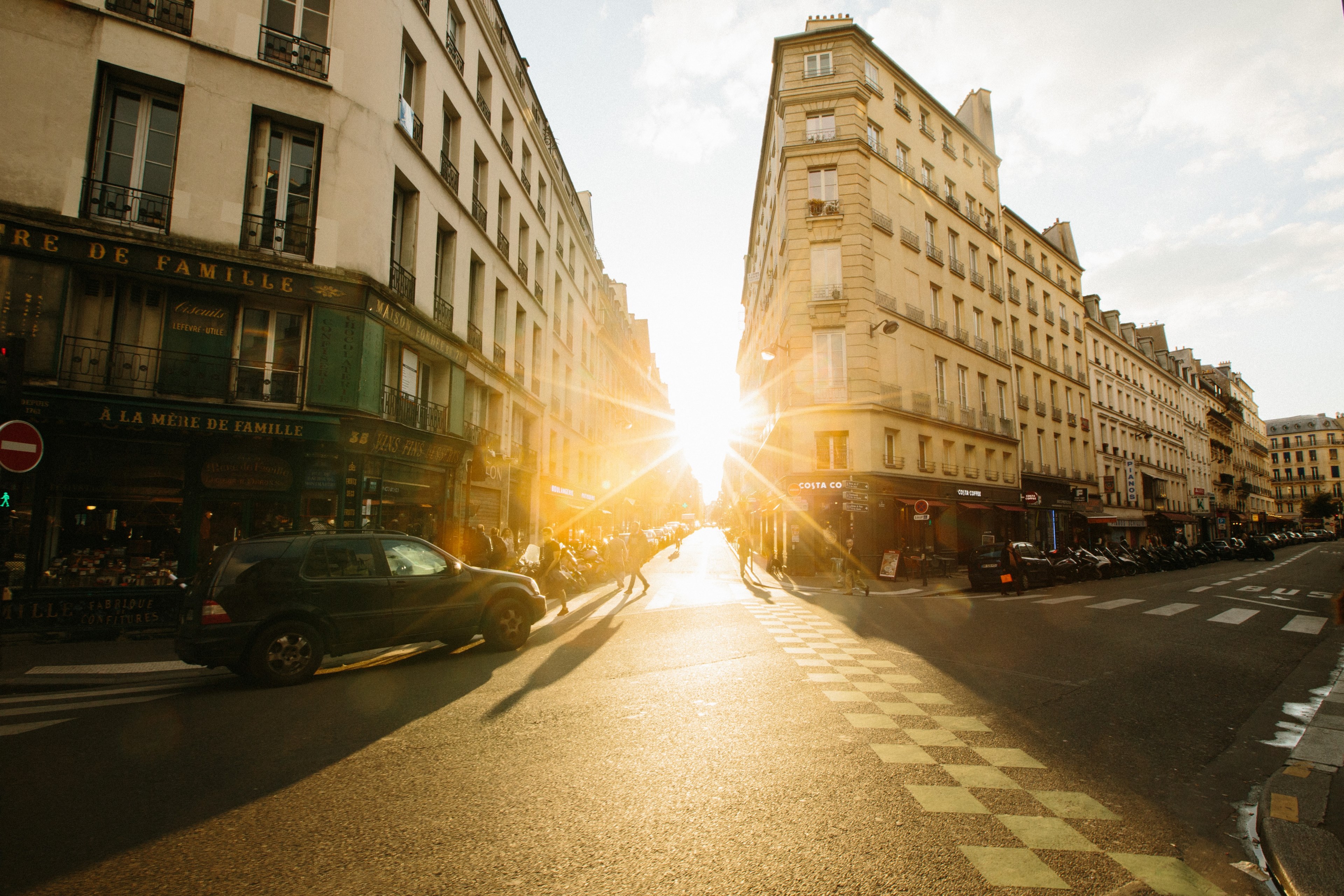 sunset on a street in paris with a green vehicle pedestrian crossing and traditional parisien buildings, sunset paris street 4k, HD Wallpaper