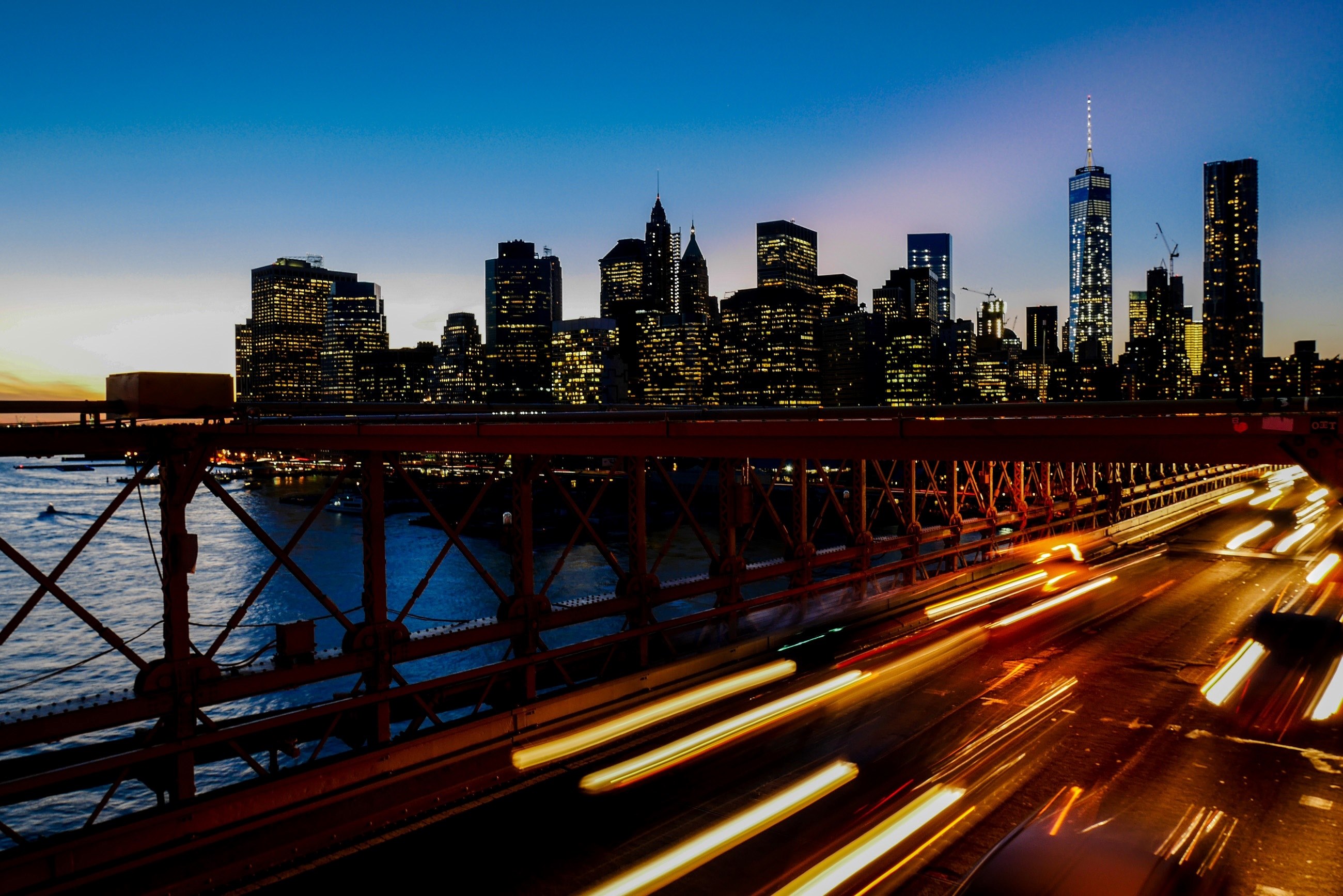 a long exposure shot of light trails on the freeway with the new york city skyline at the back, new york skyline with light trails 4k, HD Wallpaper