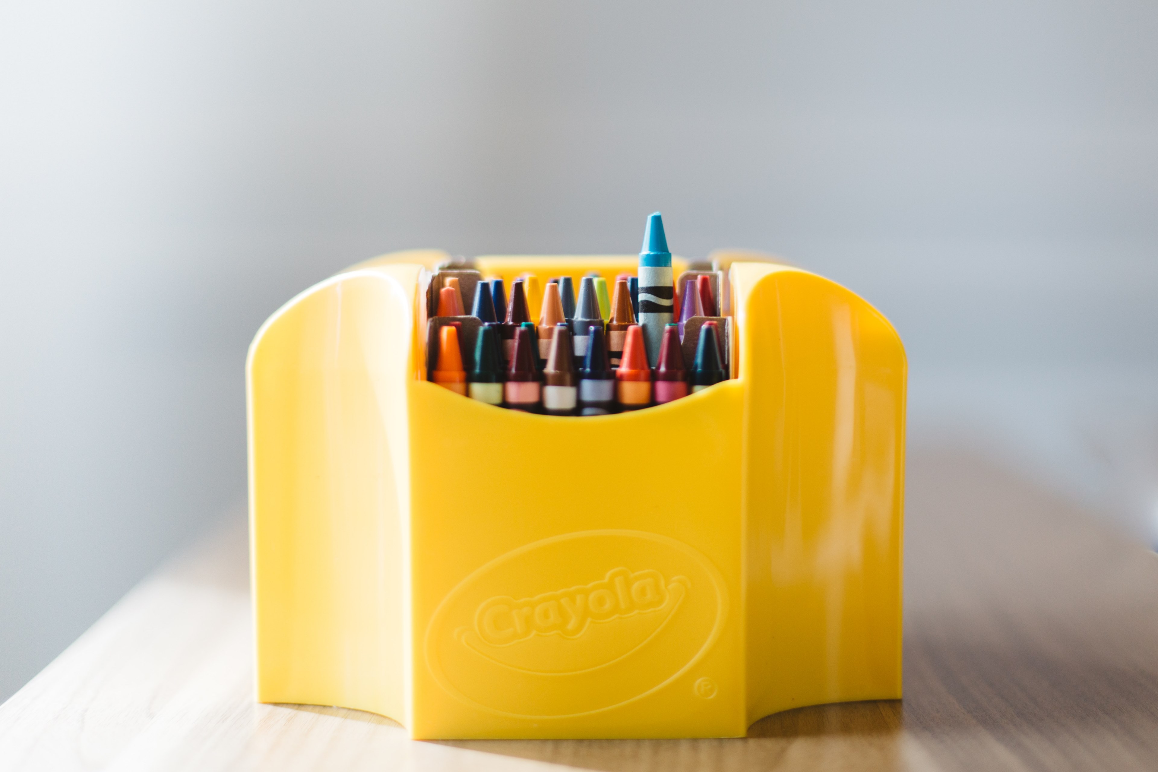yellow box of crayons sit on a wooden table, coloring box 4k, HD Wallpaper