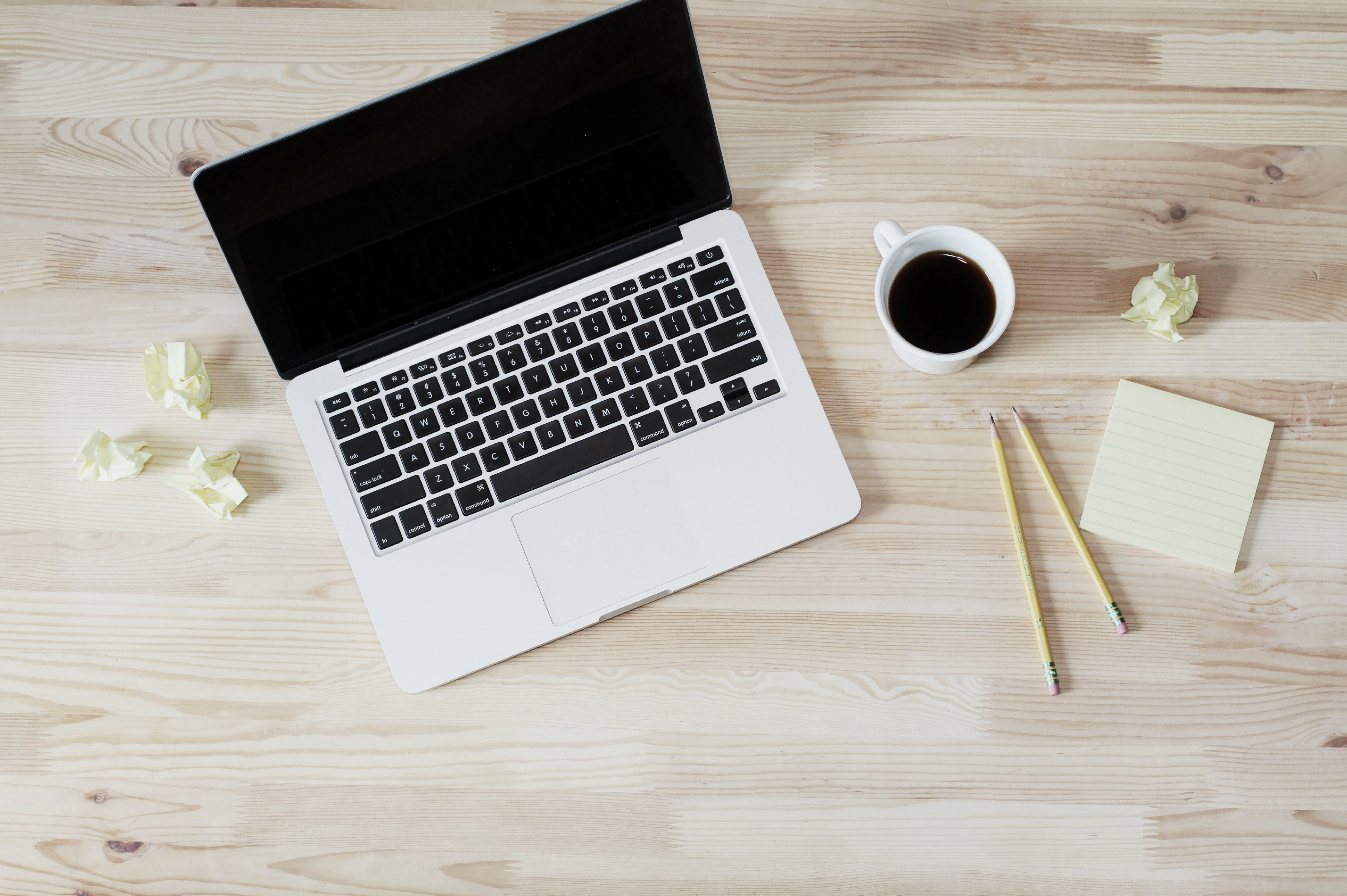 an overhead shot of a cup of coffee next to an open laptop two pencils and a stack of sticky notes, taking notes at coffee time 4k, HD Wallpaper