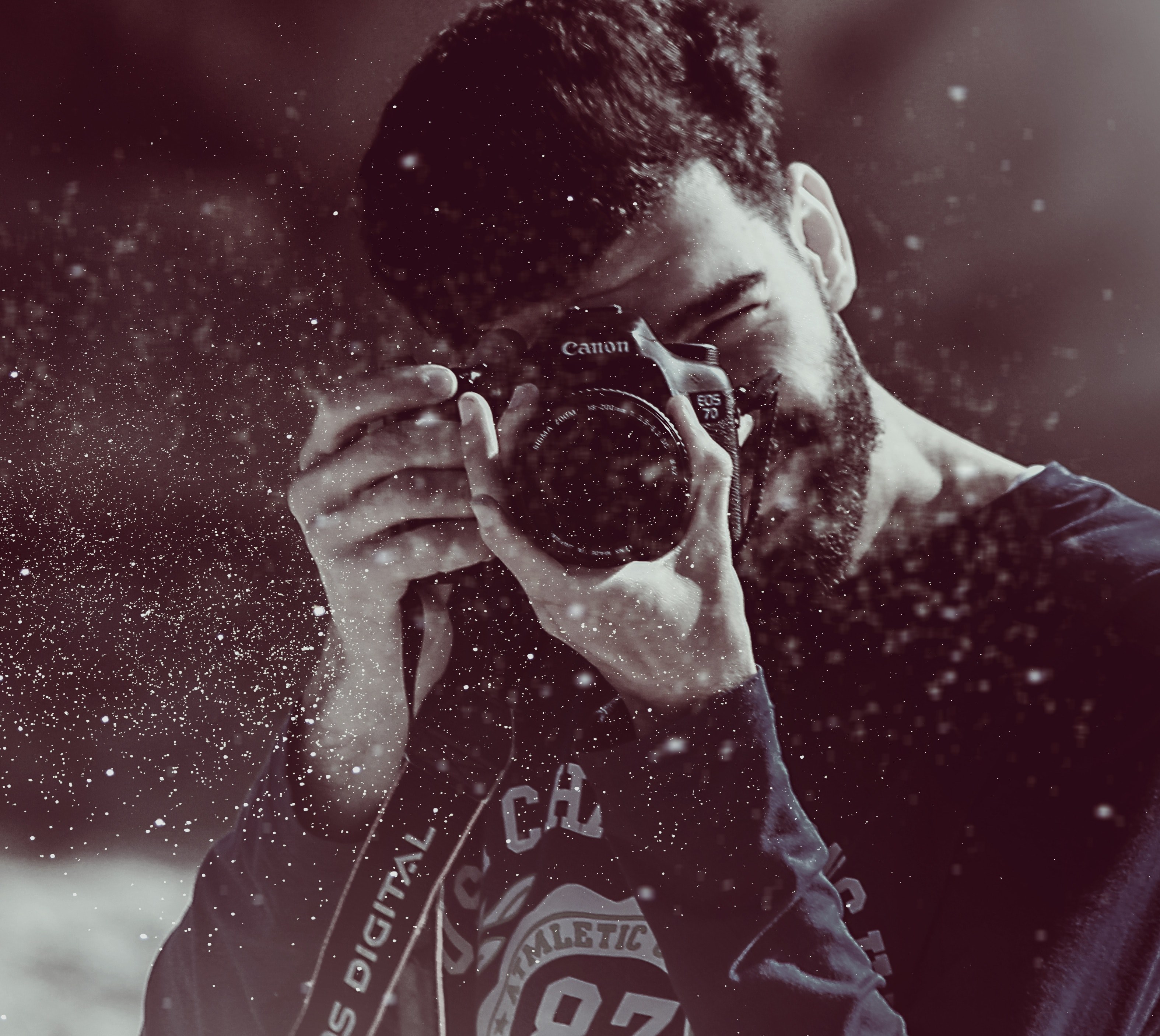 young dark haired man with beard wearing sweatshirt taking a photo in asilah, slow motion 4k, HD Wallpaper