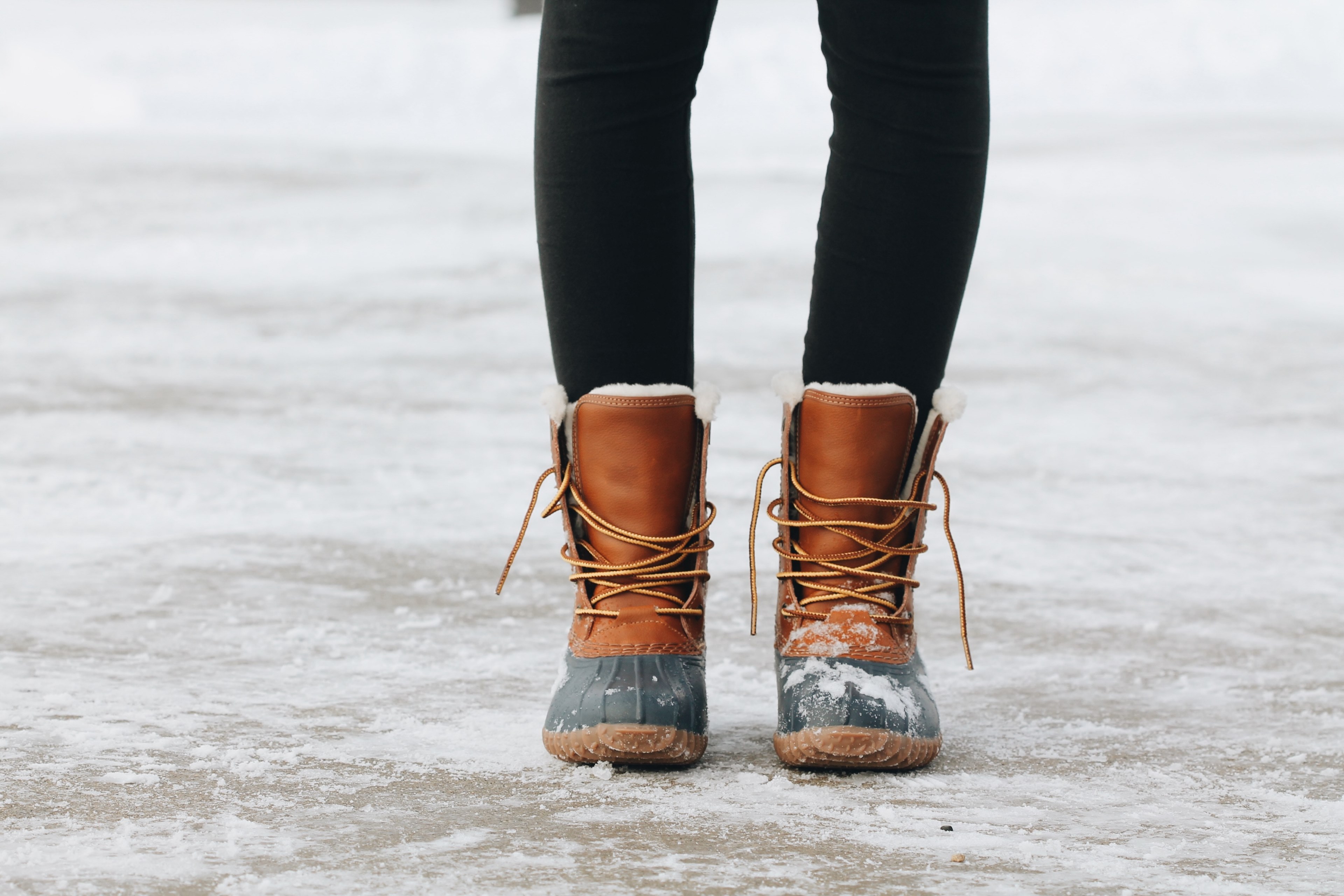 a close up shot of a woman wearing brown boots in spirit lake, snowy tootsies 4k, HD Wallpaper