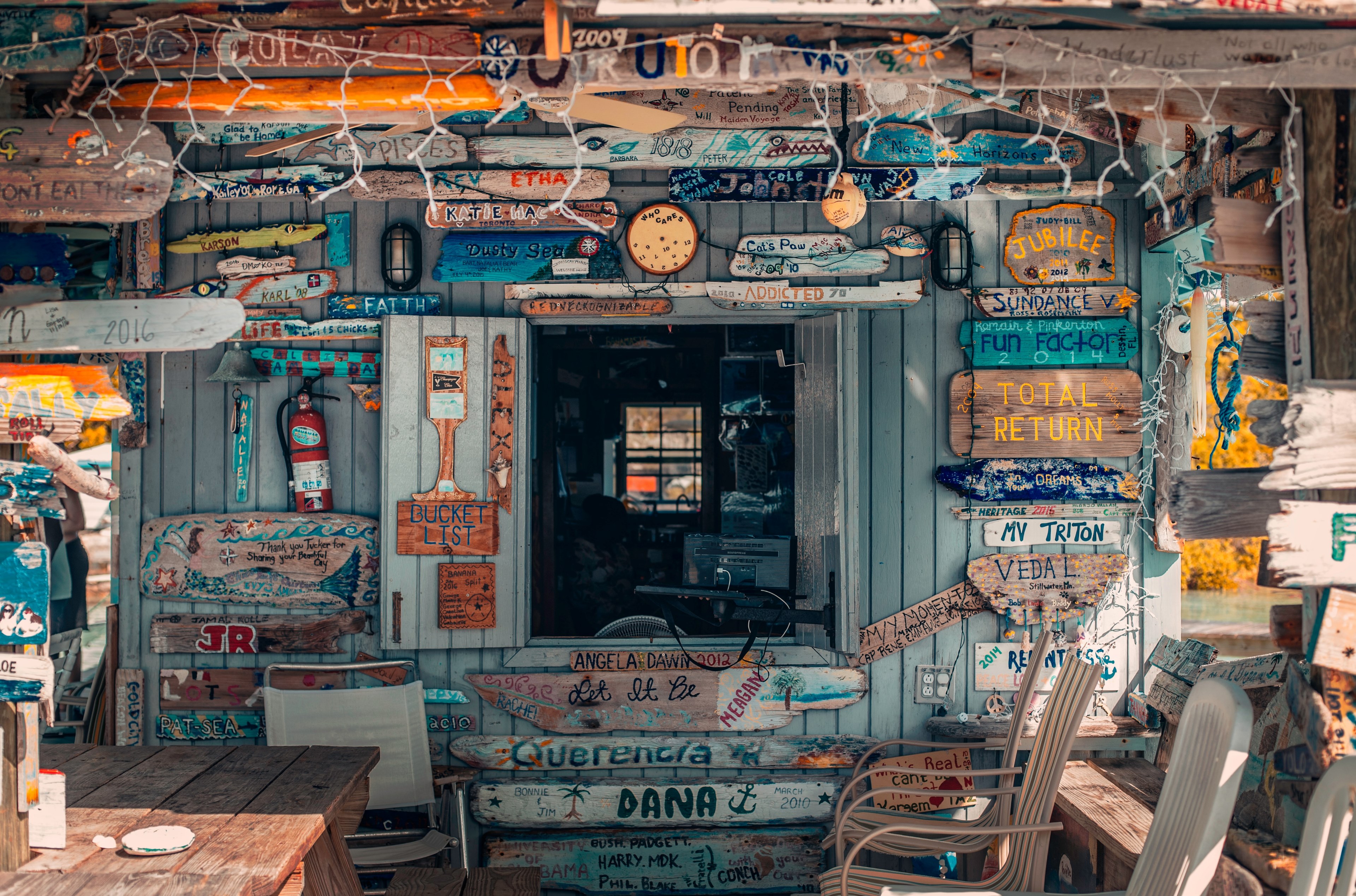 wooden building front covered with wooden signs in exuma, were all lost here 4k, HD Wallpaper