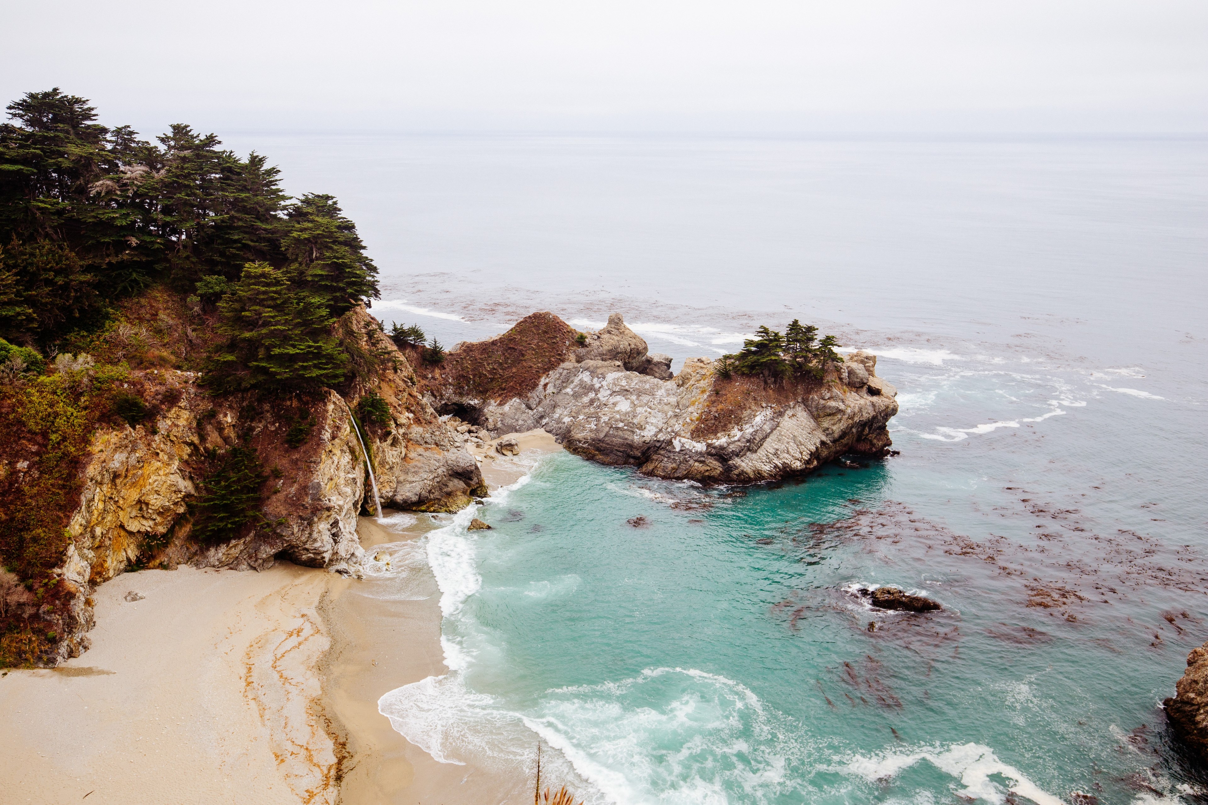 view of rock cliffs and a sand beach by the ocean at mcway falls, mcway falls 4k, HD Wallpaper