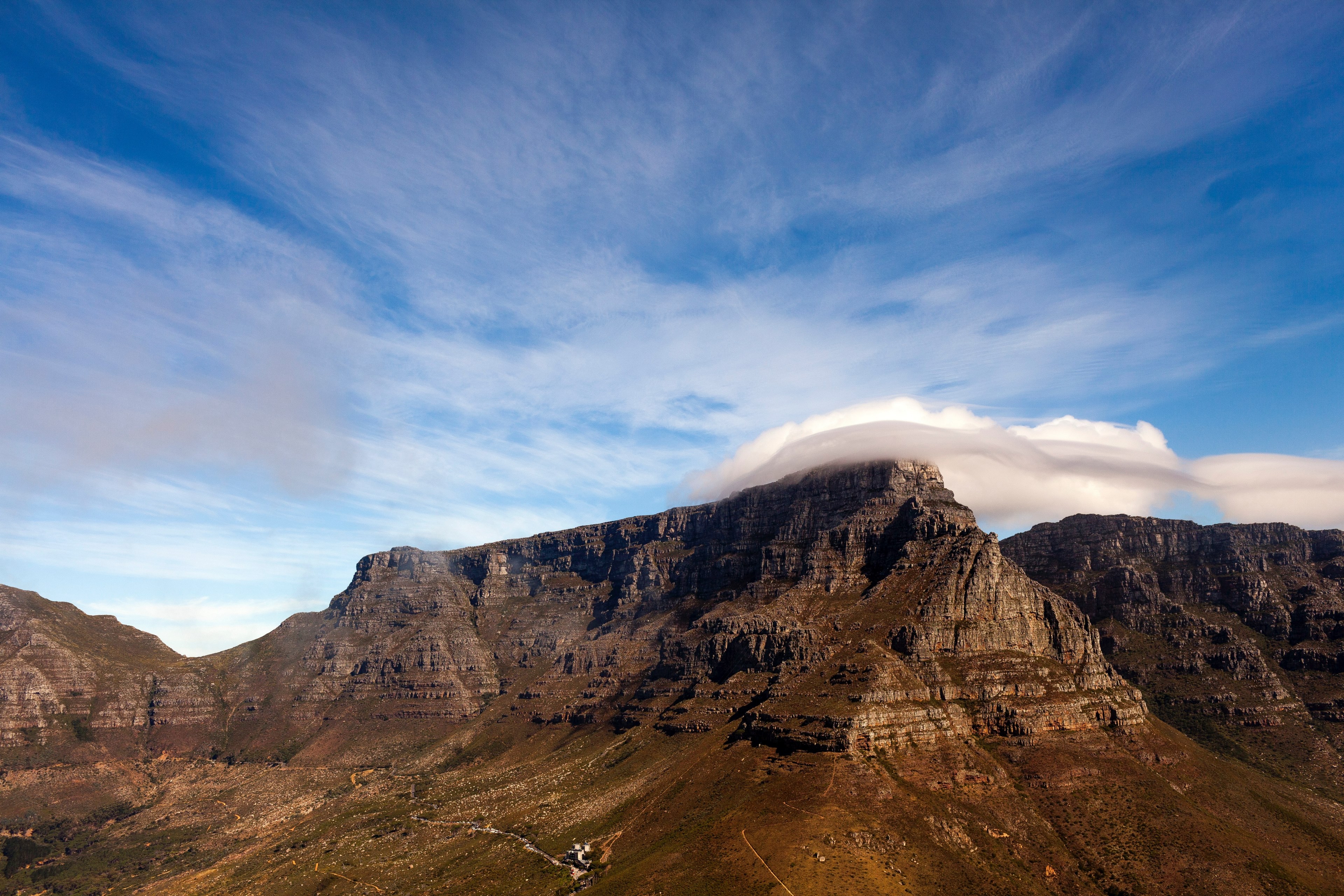 a large flat mountain with large fluffy clouds hovering above, clouds over a flat mountain 4k, HD Wallpaper