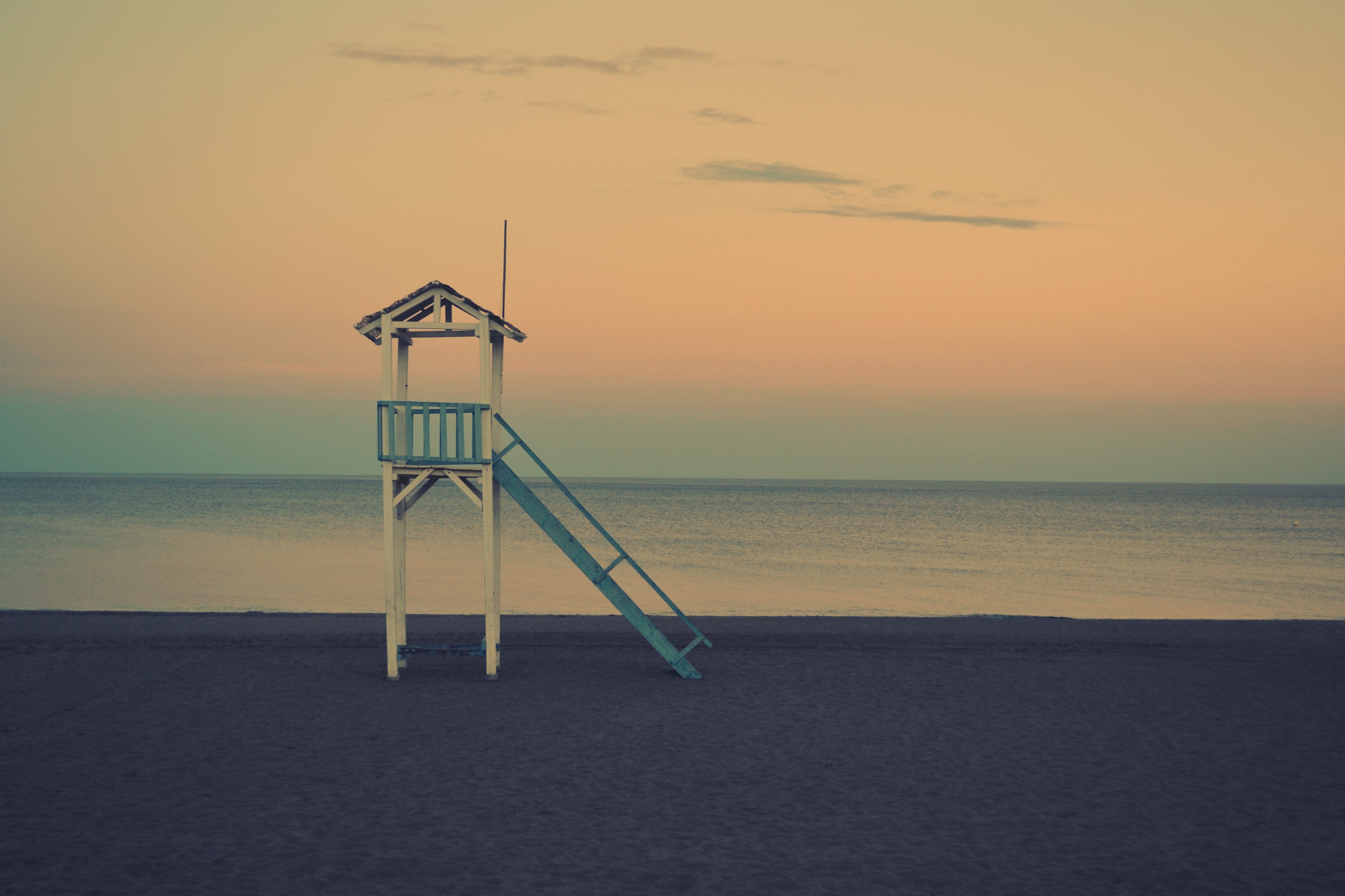 serene view of a beach featuring the ocean and lifeguard watchtower, lifeguard watchtower in beach 4k, HD Wallpaper