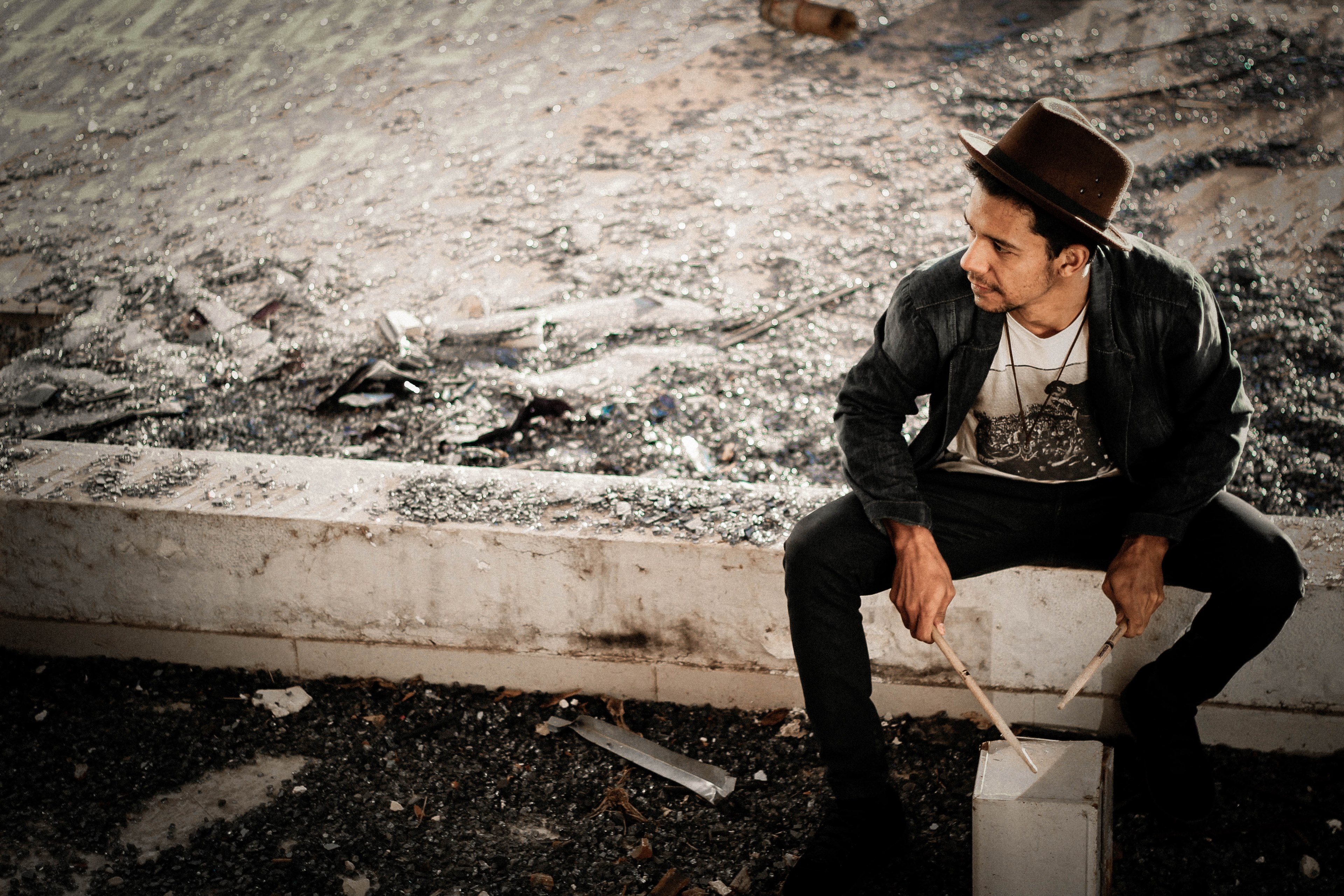 a man wearing a hat and a denim shirt drumming on a wooden box on the street, makeshift drum 4k, HD Wallpaper