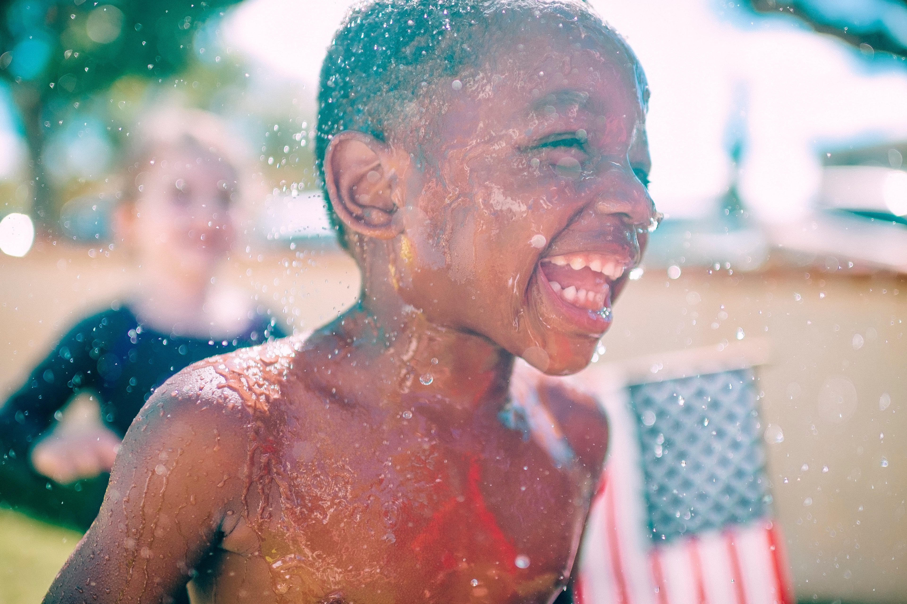 a boy laughing and running through splashing water on a sunny day, boy laughs and splashes 4k, HD Wallpaper