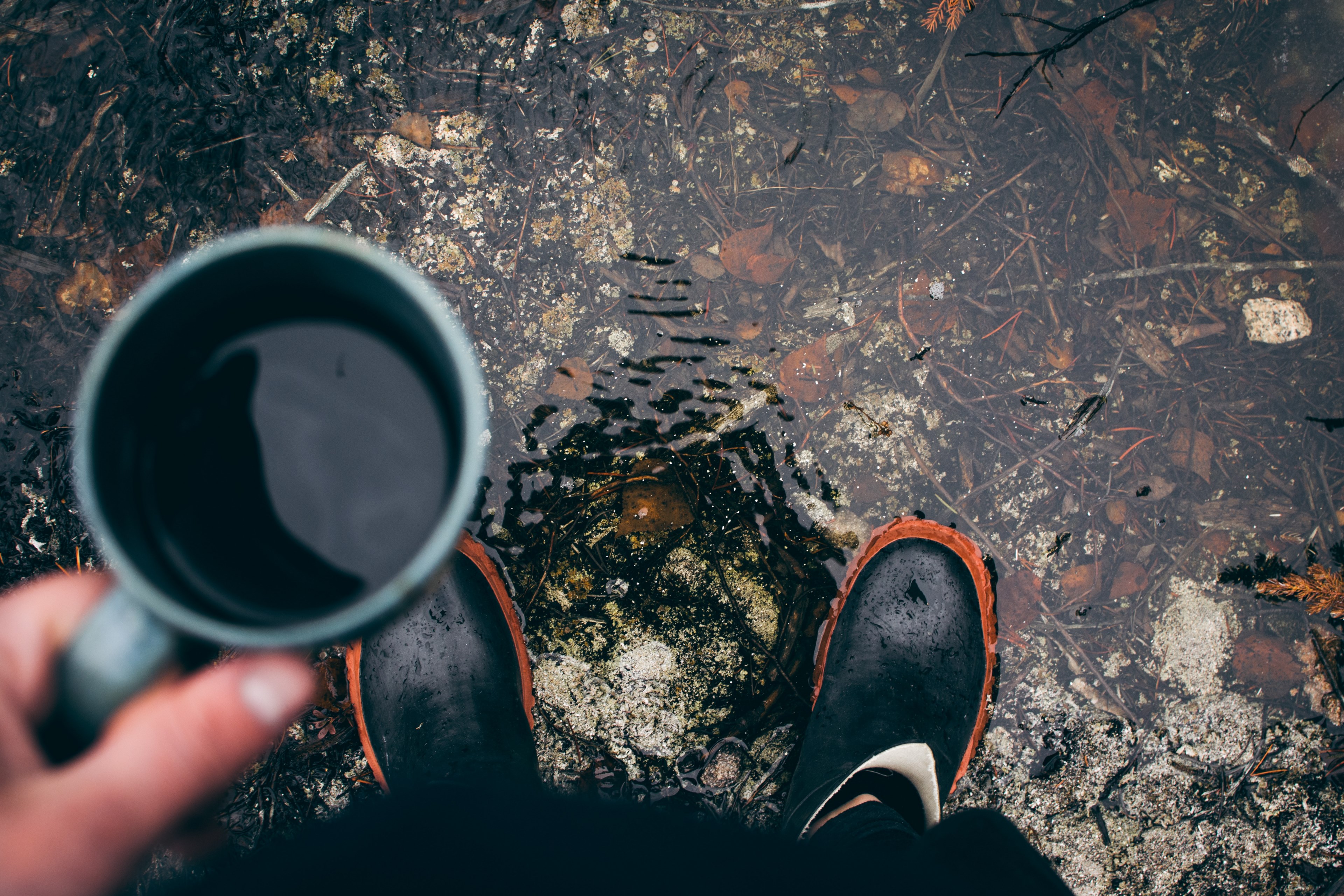 a person wearing rain boots stands in a puddle looking down and holding coffee, morning coffee 4k, HD Wallpaper