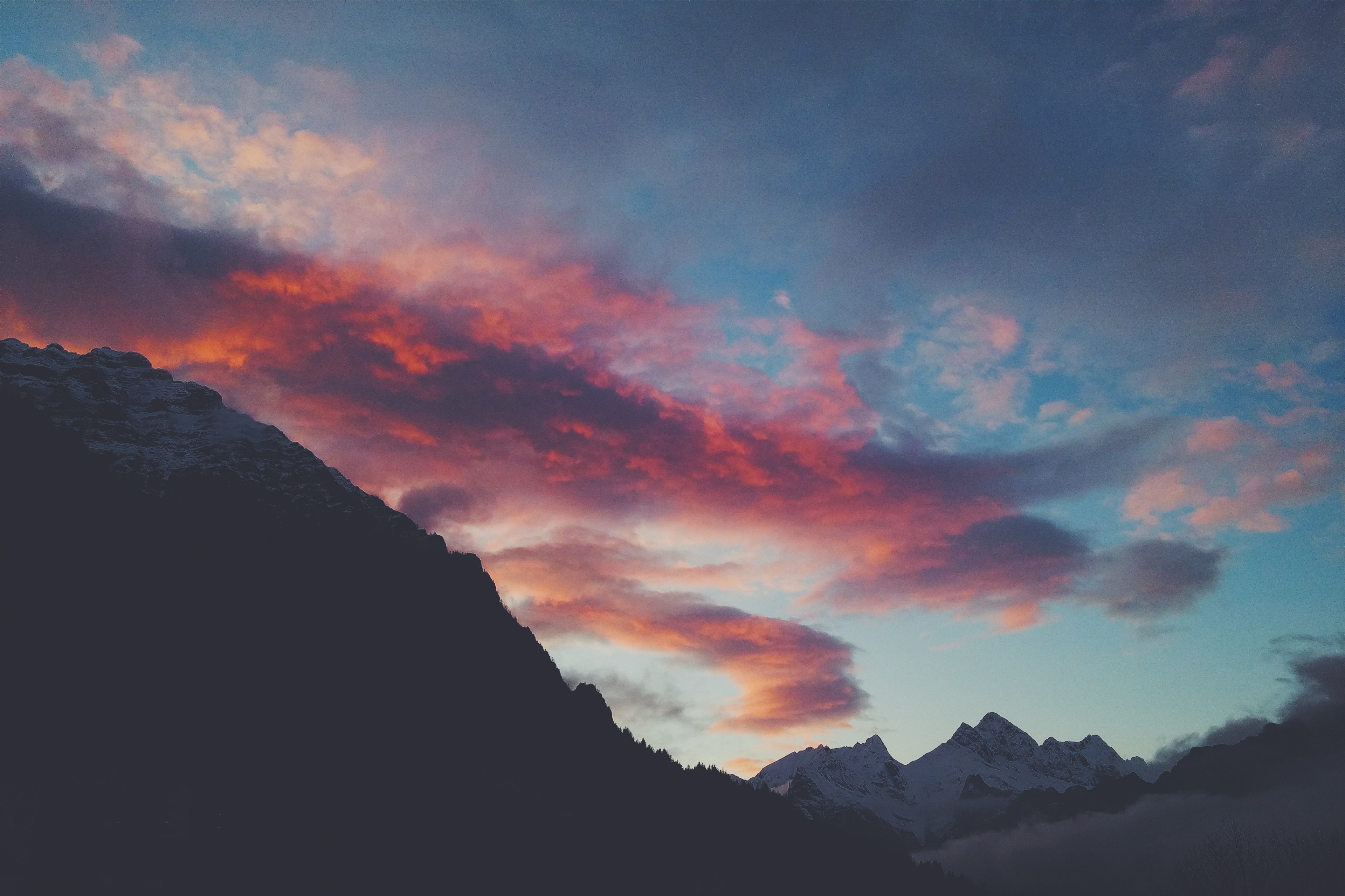 a large red cloud moving through the blue sky over snow capped mountains, red cloud over snowy mountains 4k, HD Wallpaper