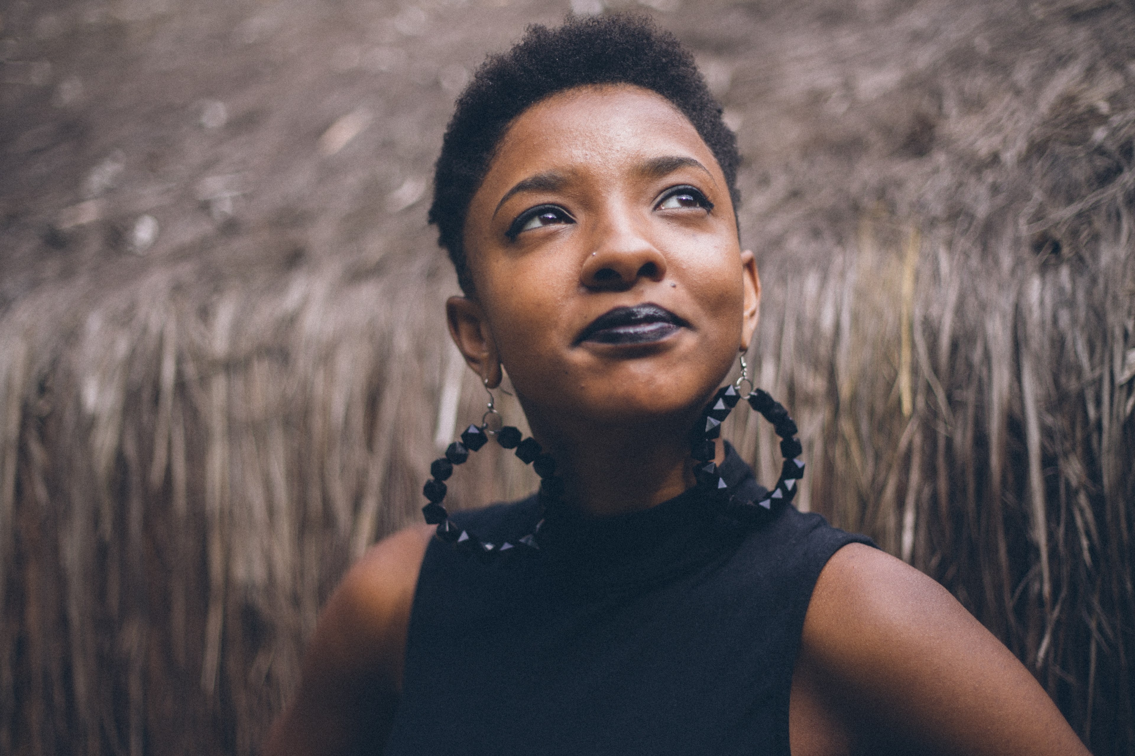 confident chic woman looks up proudly, black lipstick and earrings 4k, HD Wallpaper