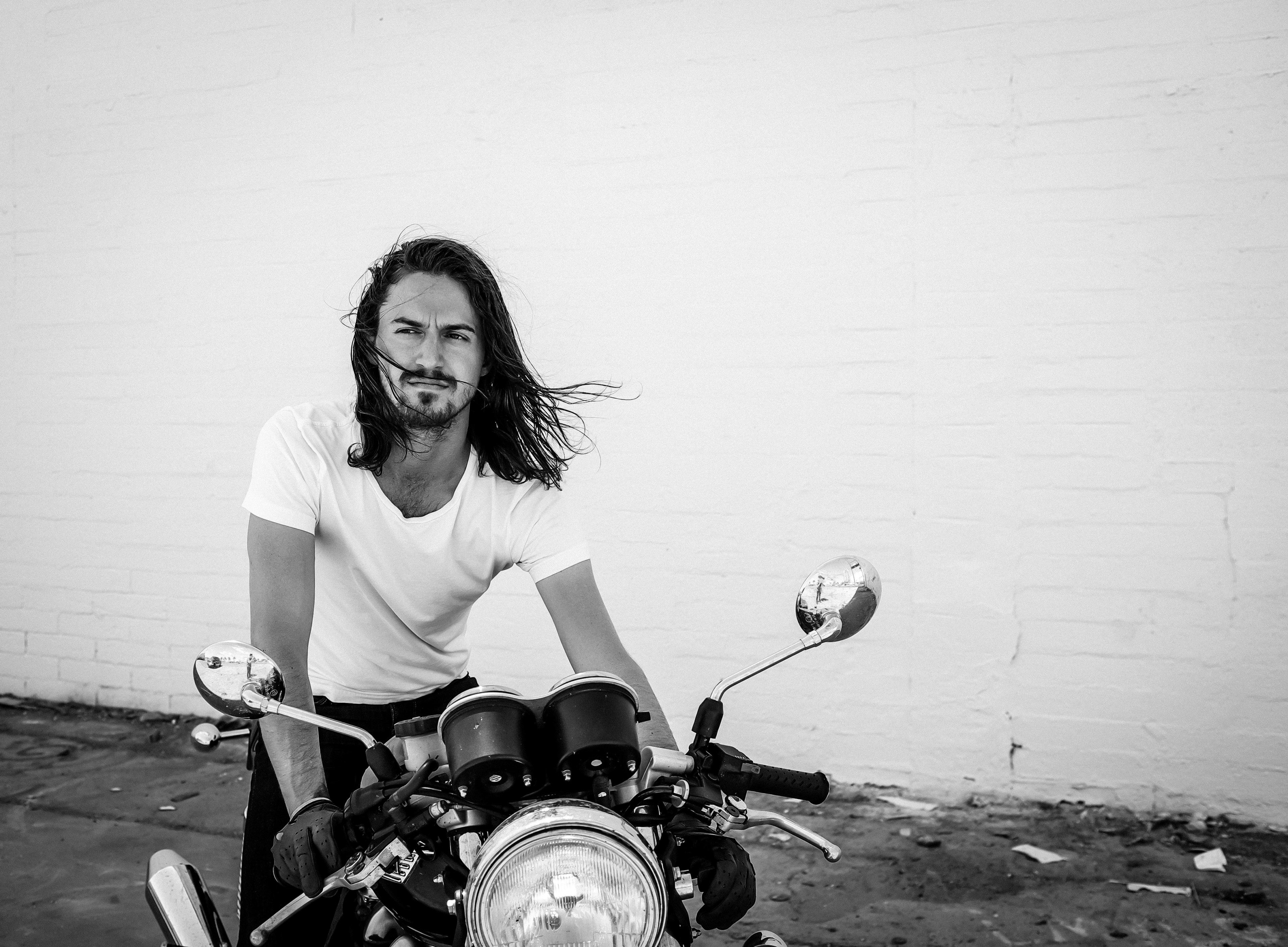 black and white shot of attractive long haired man in white t shirt with motorbike, long haired man with motorbike 4k, HD Wallpaper