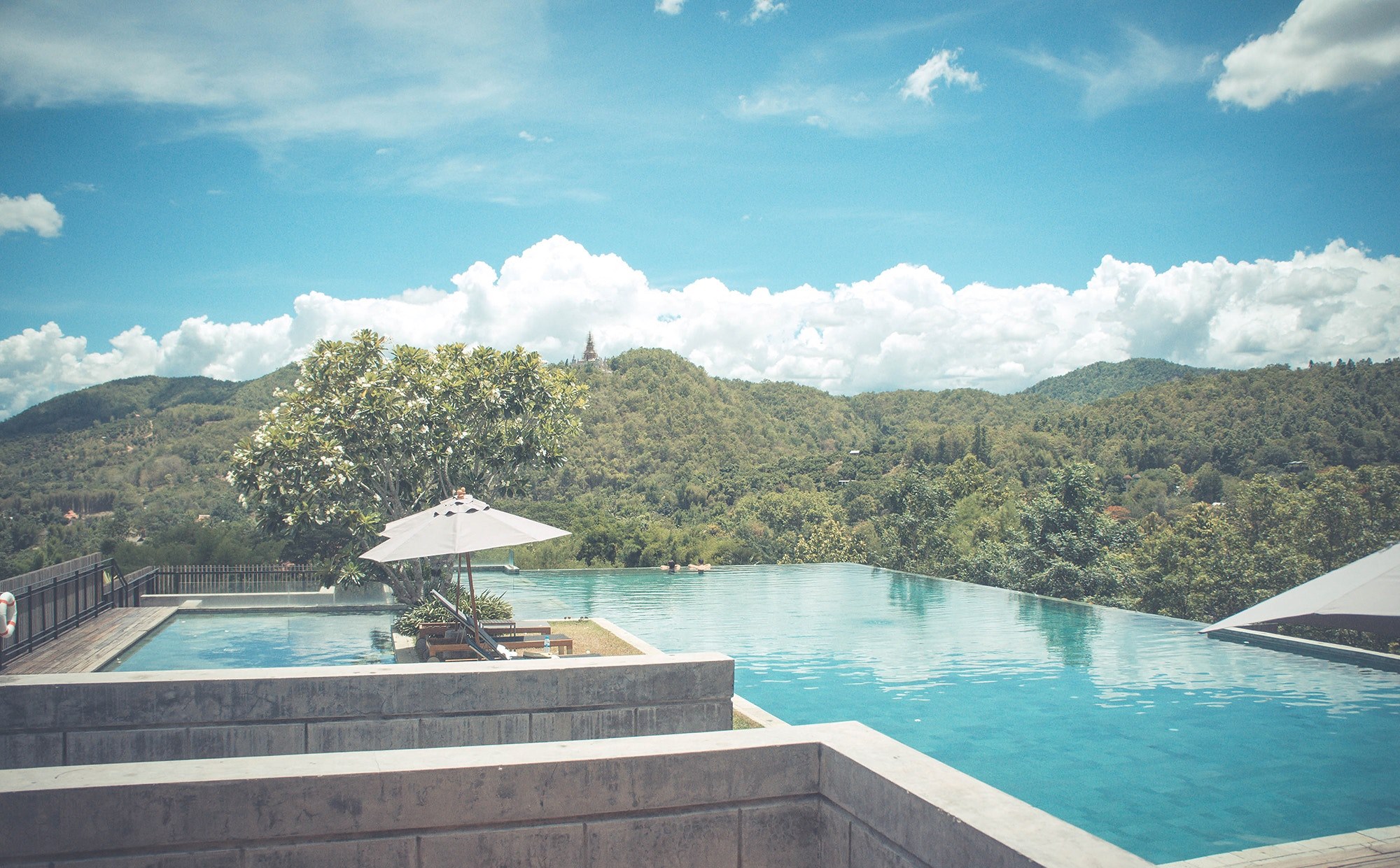 a large sunlit pool with a view on wooded hills, holiday resort on green hills 4k, HD Wallpaper