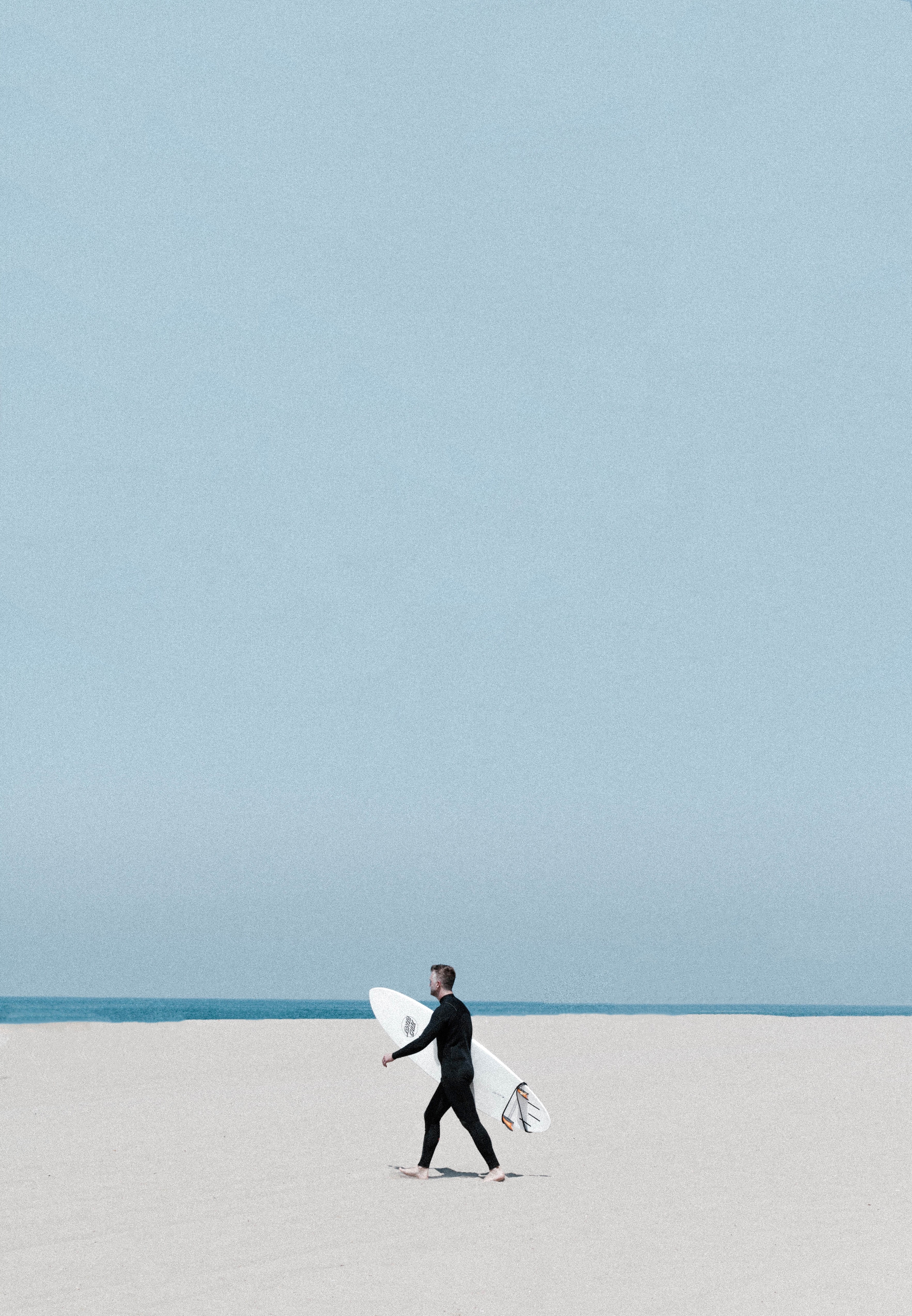 a man in a wetsuit walking on the beach holding a surfboard in los angeles, los angeles wetsuit surfboard 4k, Phone HD Wallpaper