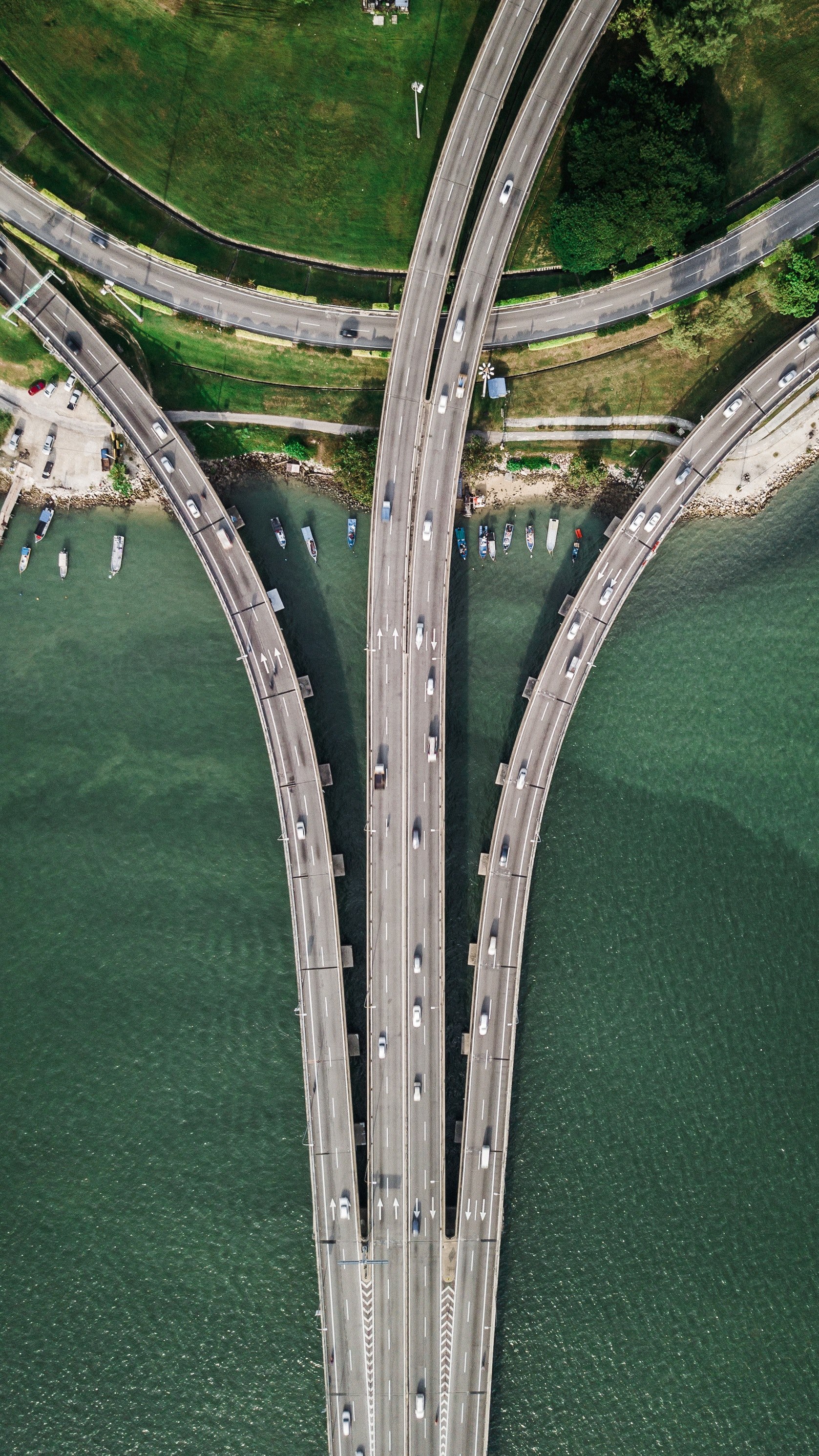 fisherman boats parked under the penang bridge 4k, Phone HD Wallpaper