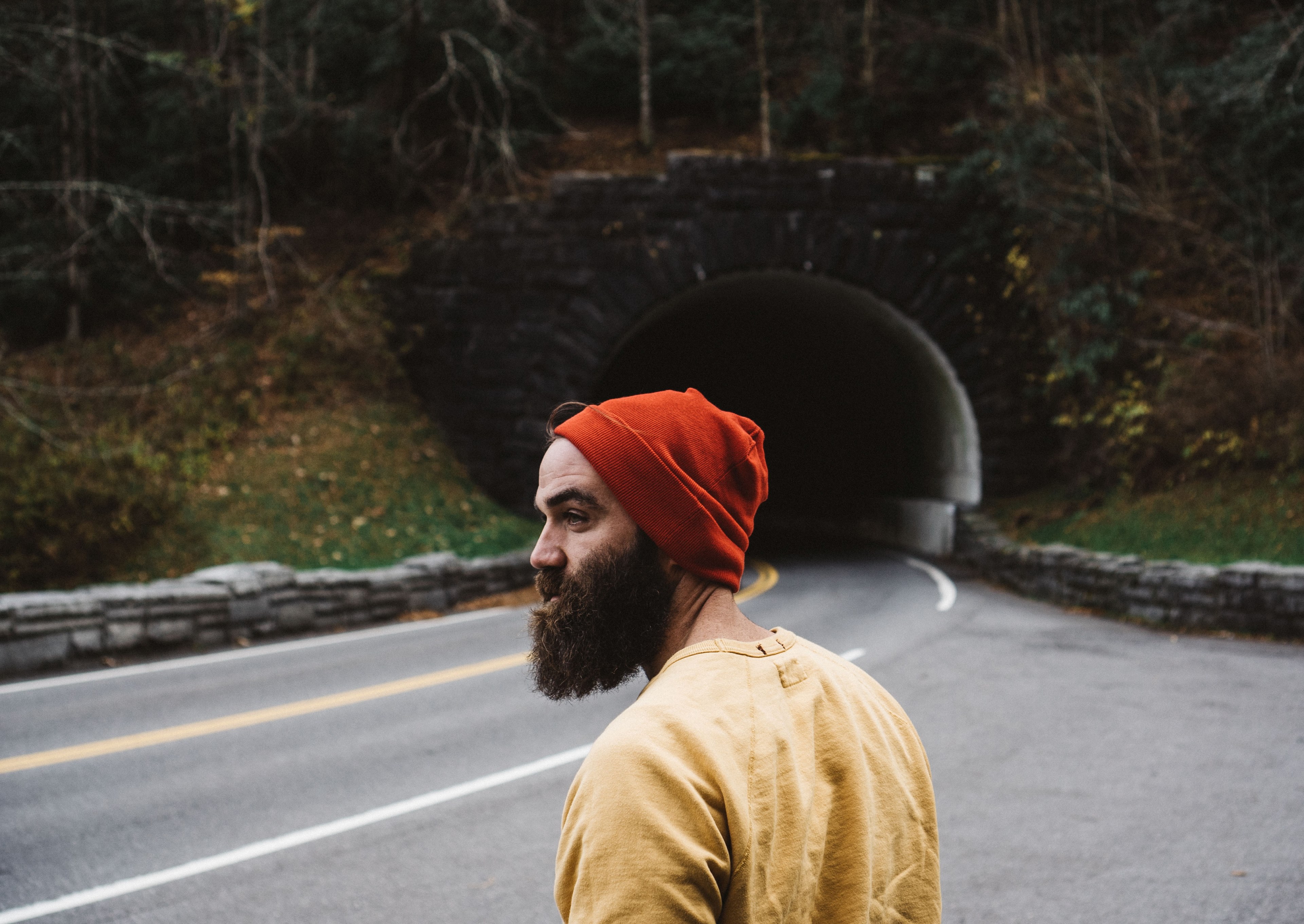 a bearded man looks at a road by a tunnel in the great smoky mountains, bearded man by the road 4k, HD Wallpaper