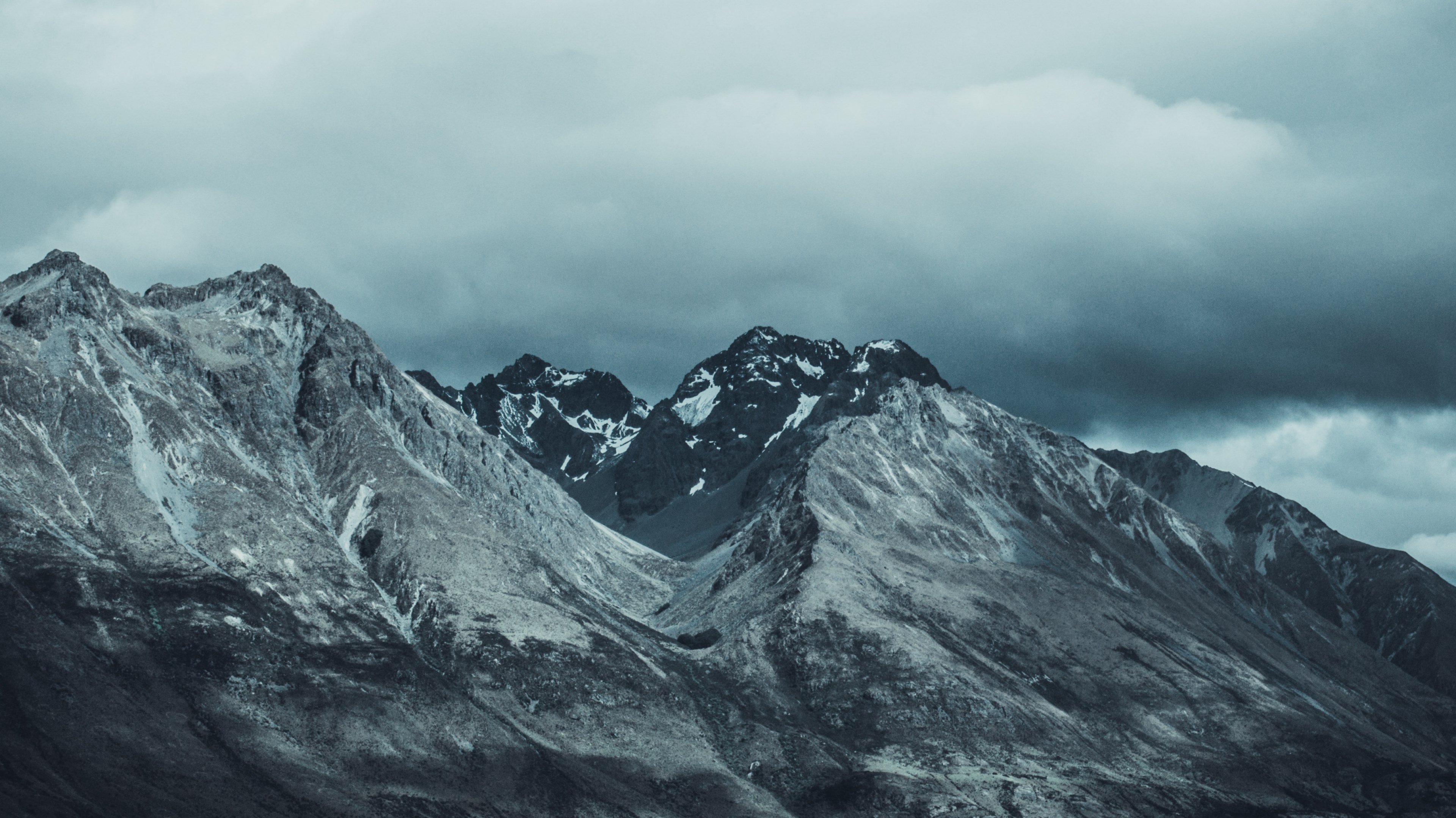 a bleak shot of snow capped mountains under thick gray clouds, queenstown peak 4k, HD Wallpaper