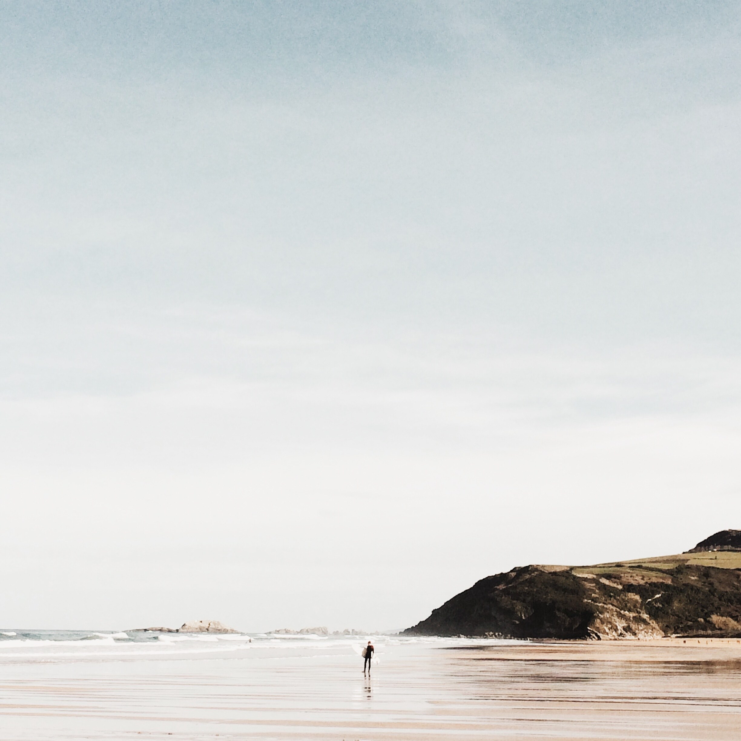 a distant person in the sea in front of a coastal rock at zarautz pas vasco espana, enjoying the sea 4k, HD Wallpaper