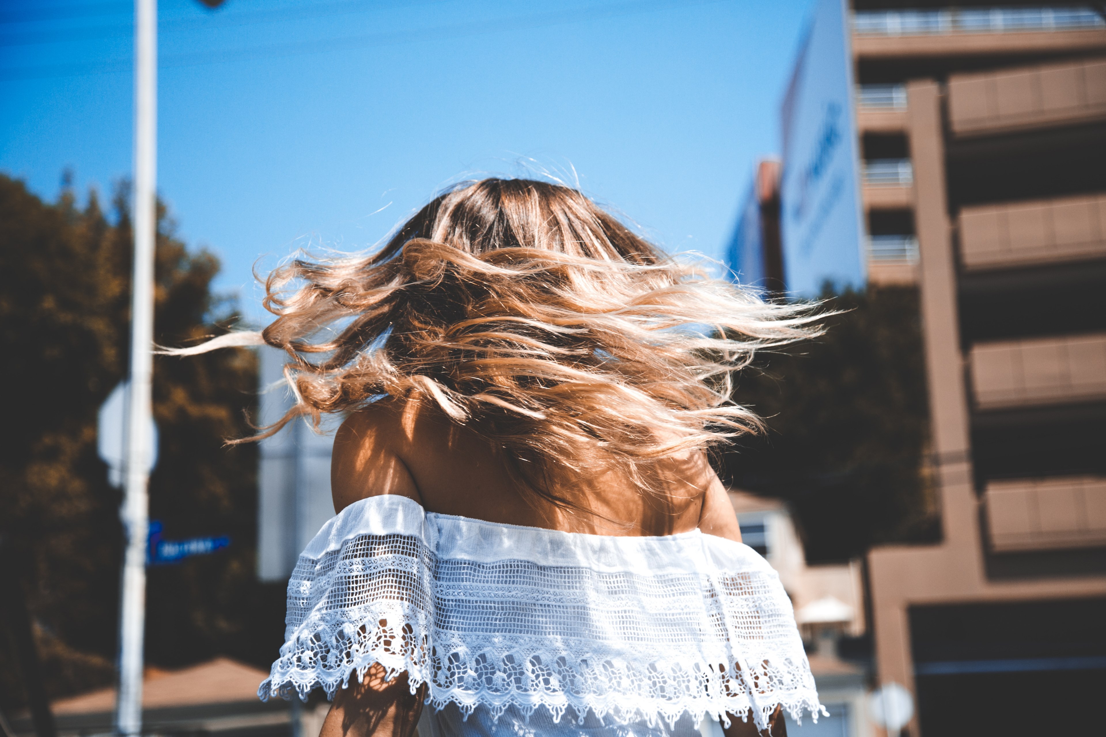 walking behind a woman with windblown hair and an off the shoulder top, let your hair out 4k, HD Wallpaper