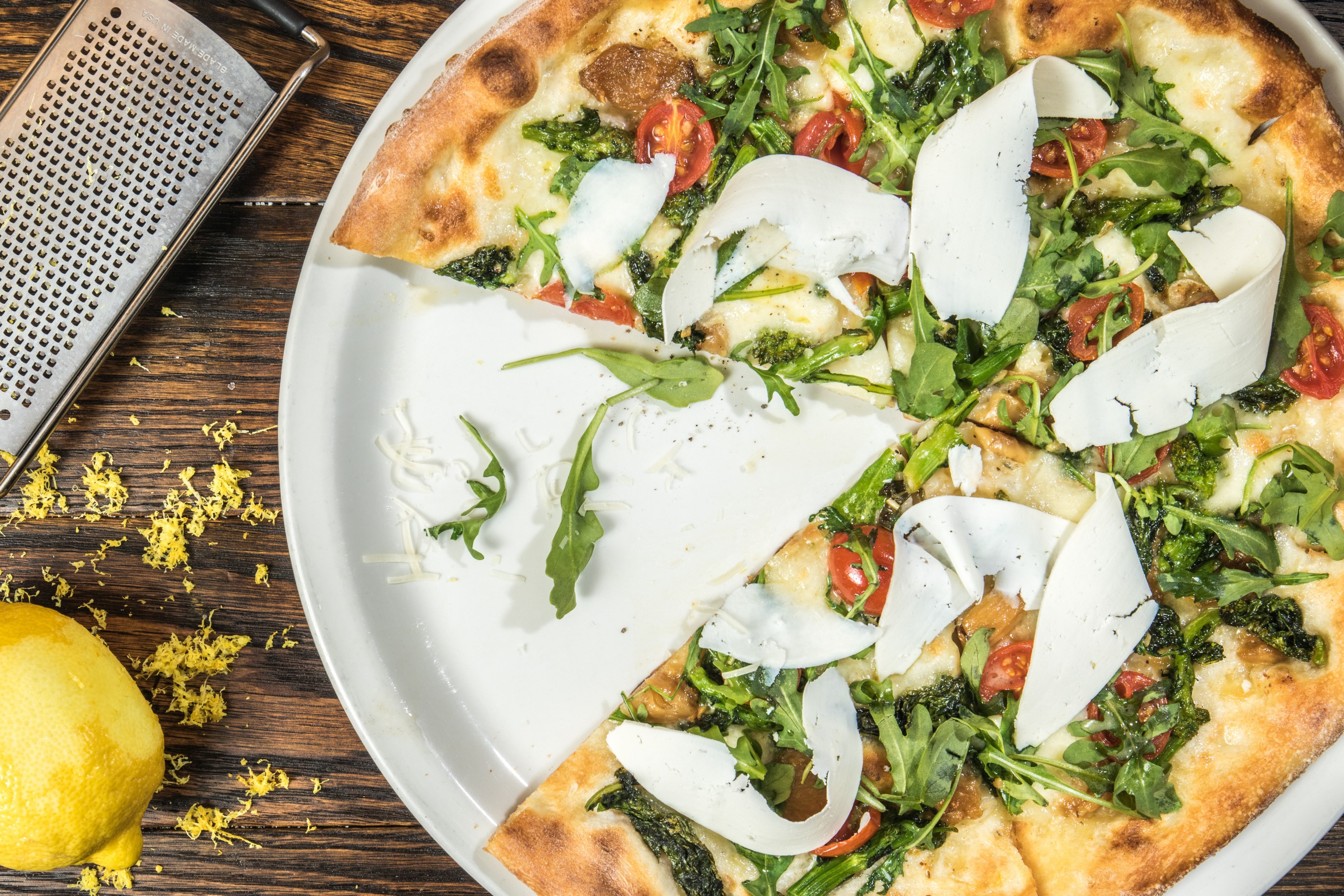 a slice taken from a pizza with cherry tomatoes leaves mozzarella cheese and grated lemon, pizza for high end italian restaurant 4k, HD Wallpaper