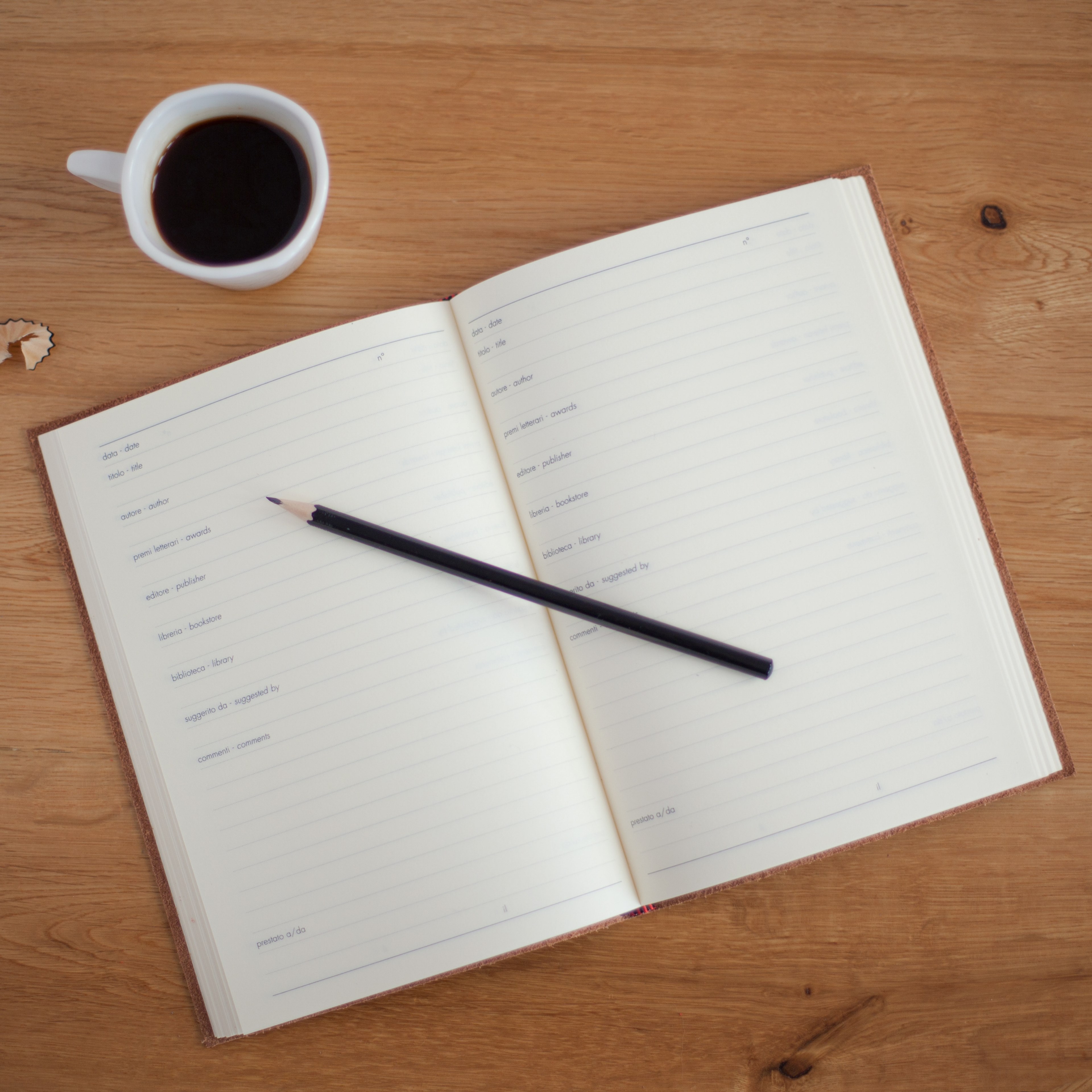 an overhead shot of a pencil on an open planner next to a cup of coffee, planning over coffee 4k, HD Wallpaper