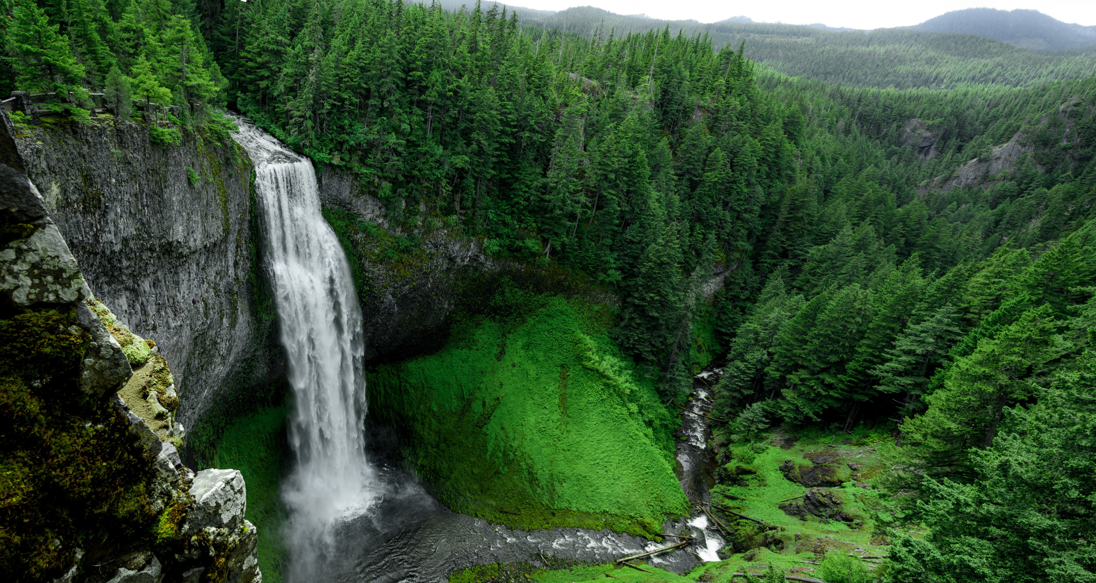 a waterfall tumbling down into a ravine in a green forest, waterfall in a ravine 4k, HD Wallpaper