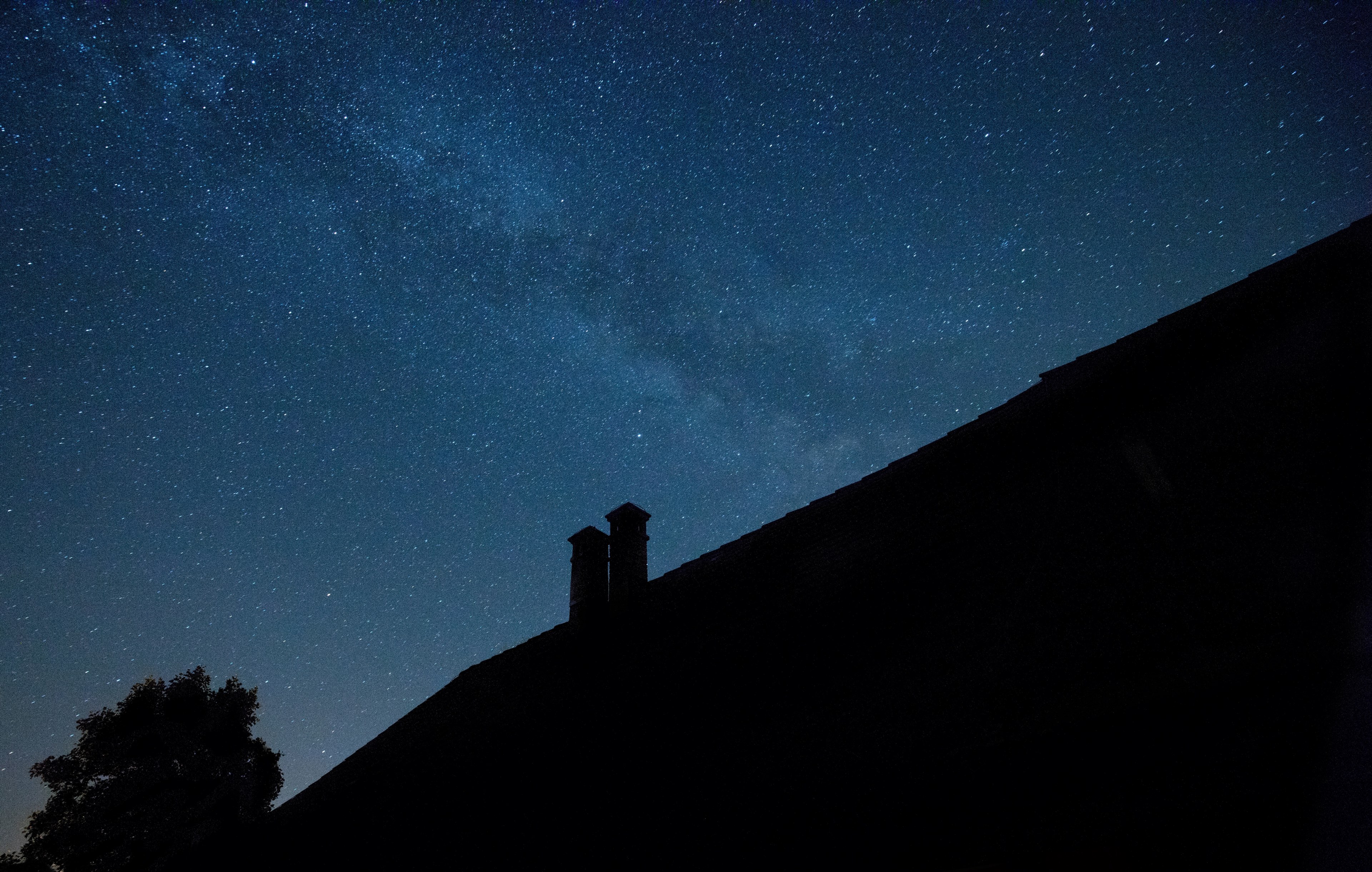 a silhouette of a chimney on the roof of a house against a starry sky, night over a quiet house 4k, HD Wallpaper