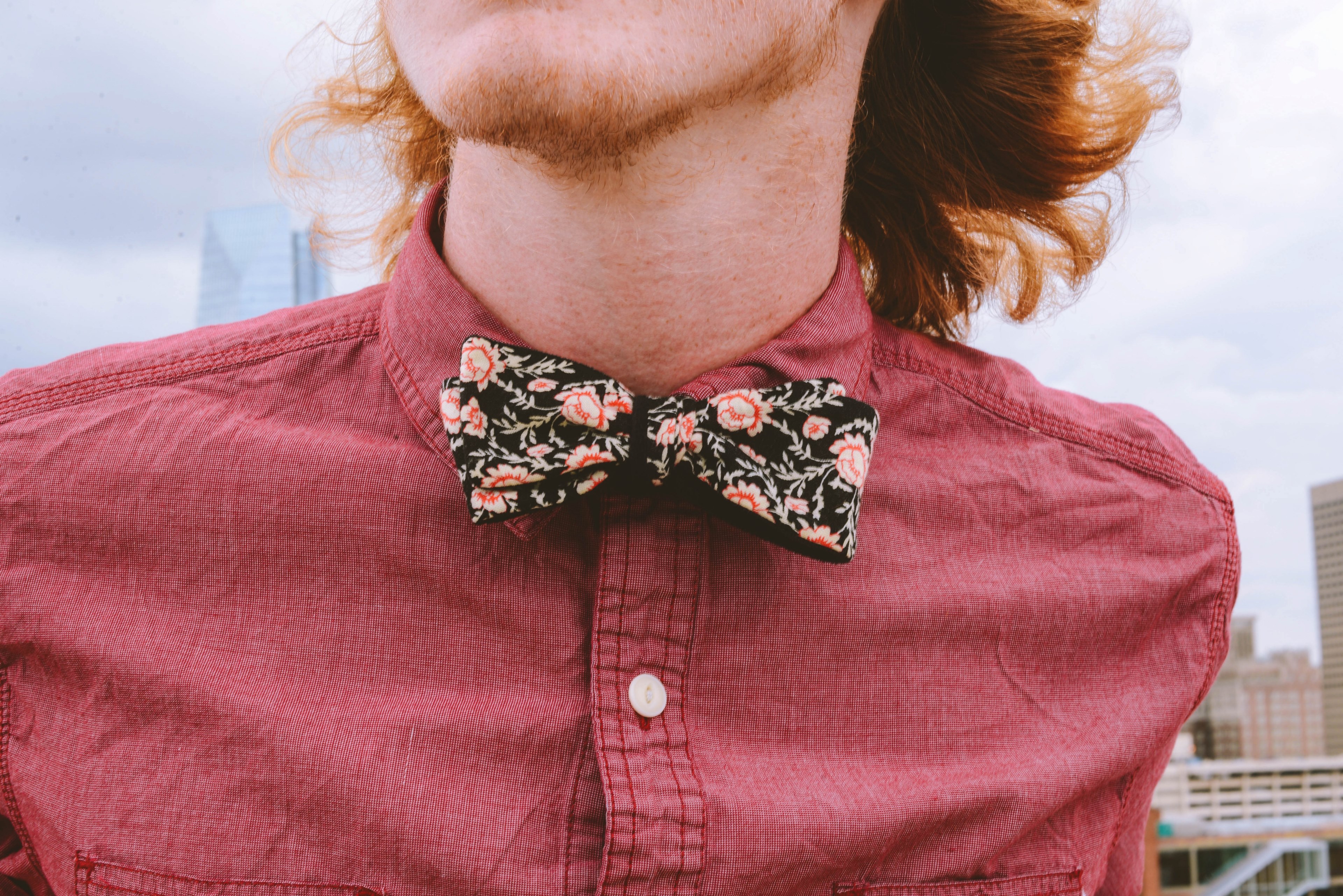 a red headed person in a floral bowtie against the downtown oklahoma city skyline, clad stache 4k, HD Wallpaper