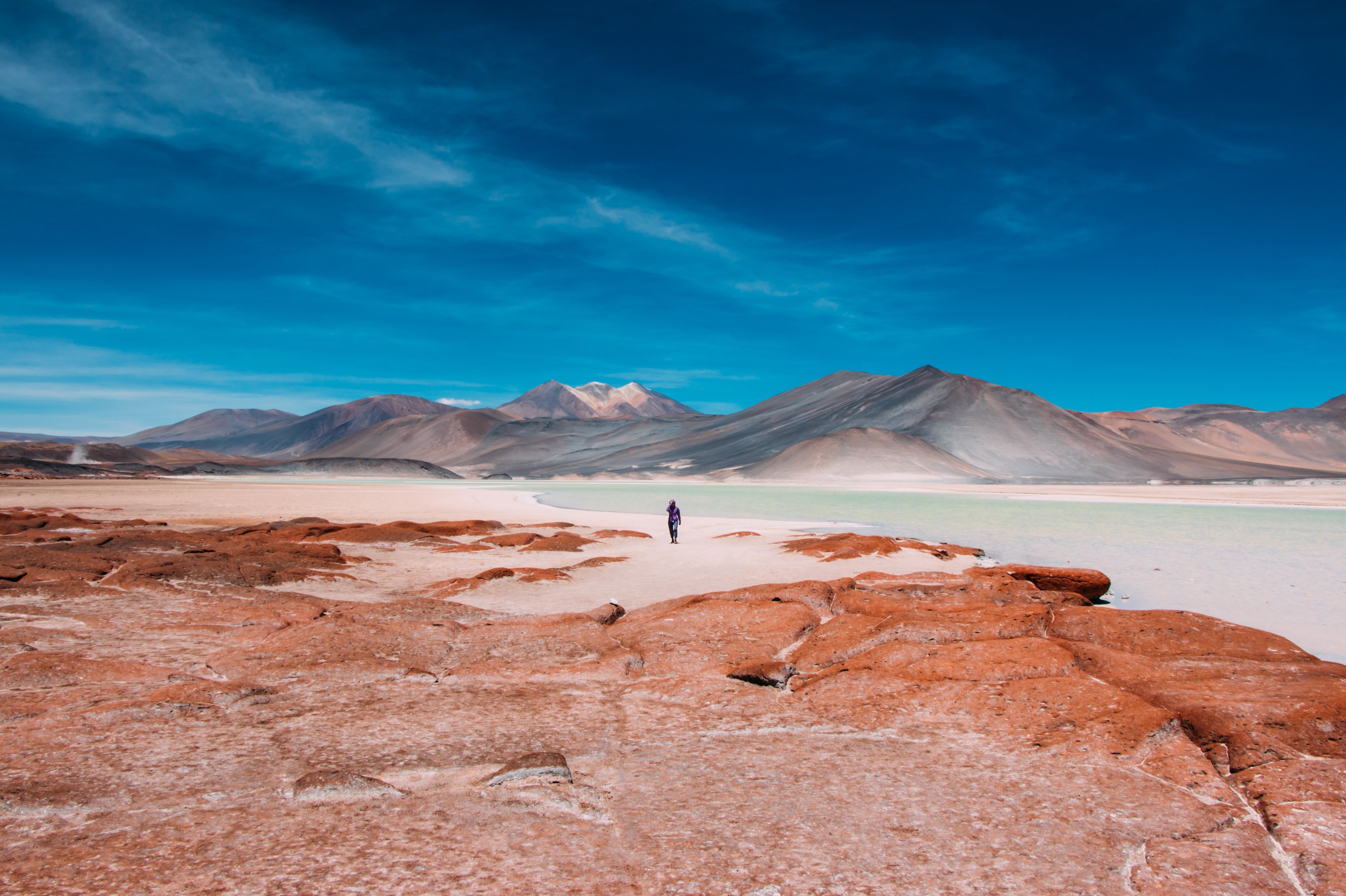 person walks toward mountains on the horizon of the atacama desert, walking through the desert 4k, HD Wallpaper