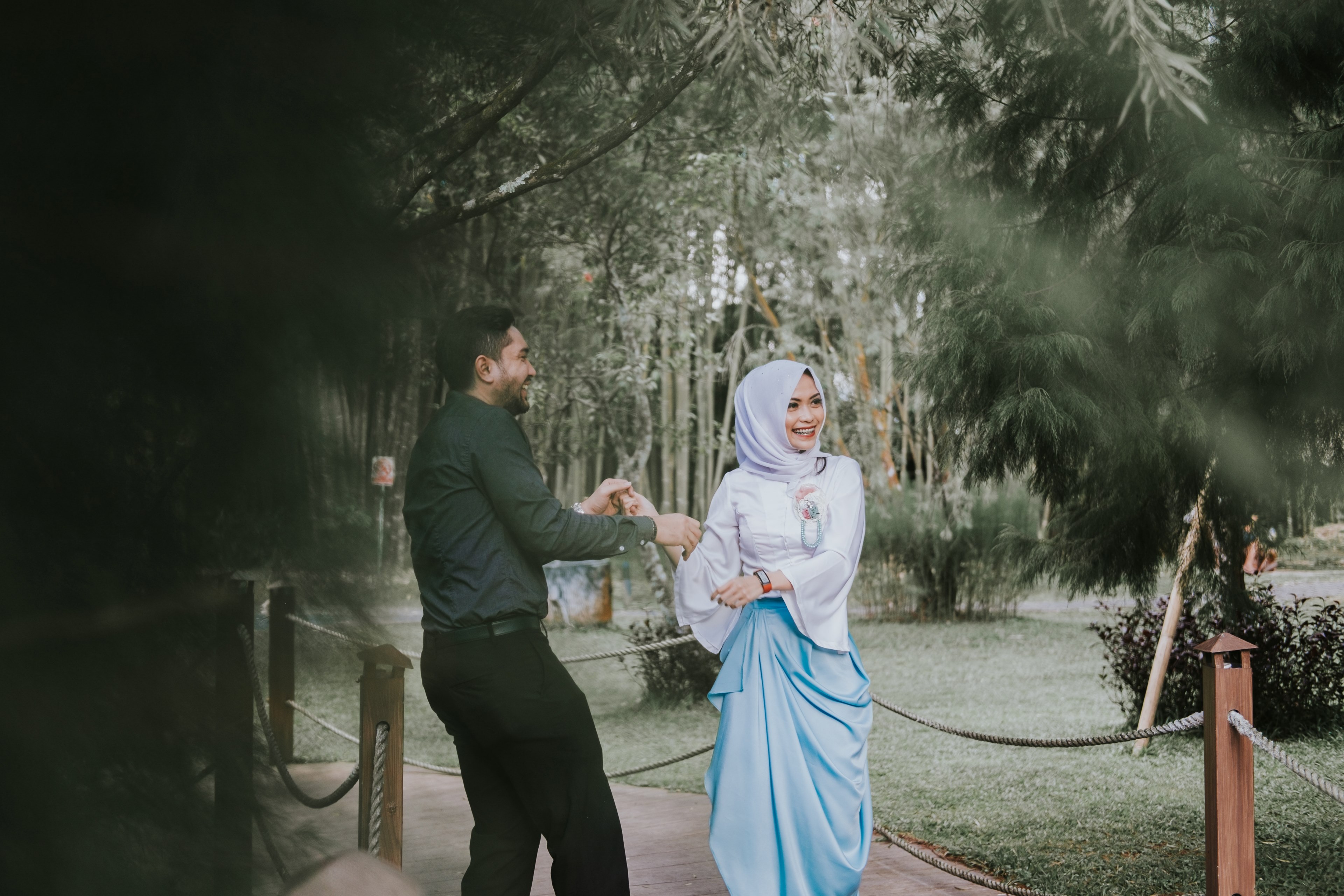 a man and woman in hijab dance on a path outside the hill hotel amp resort sibolangit, raga amp anisa 4k, HD Wallpaper