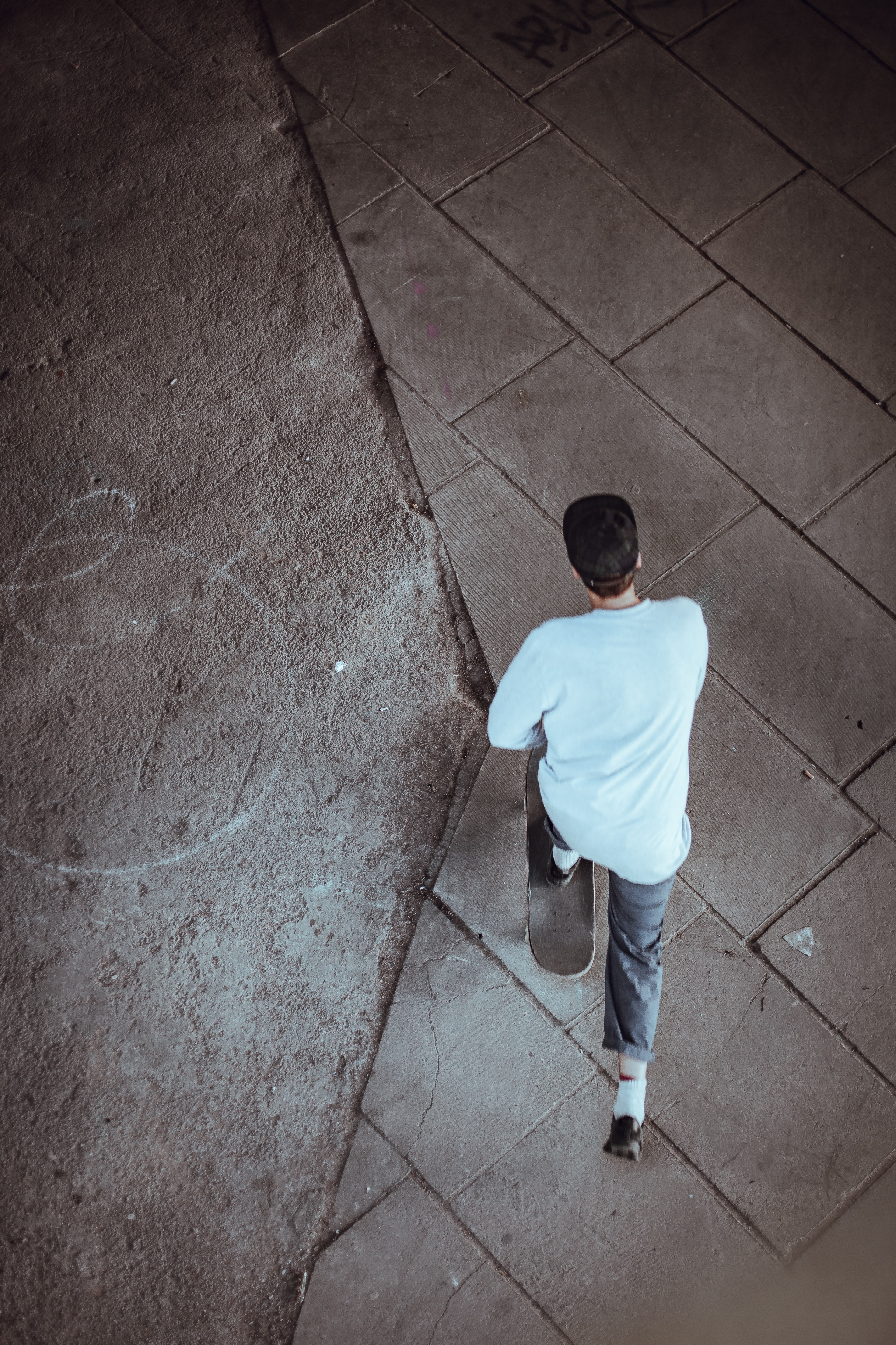 an aerial shot of a skateboarder riding on concrete ground in south bank, skater from above 4k, Phone HD Wallpaper